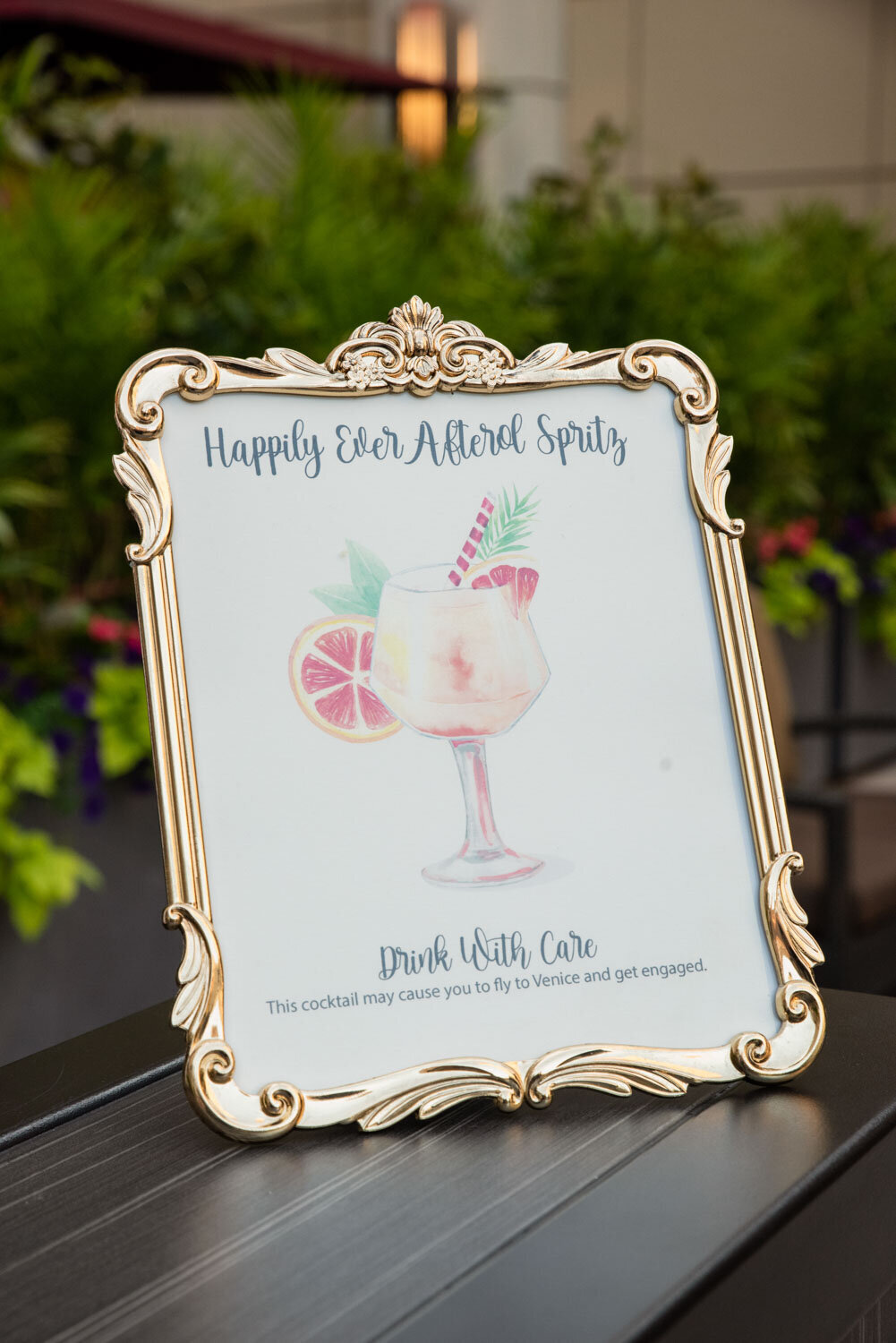 A framed picture of a happily ever after spritz cocktail