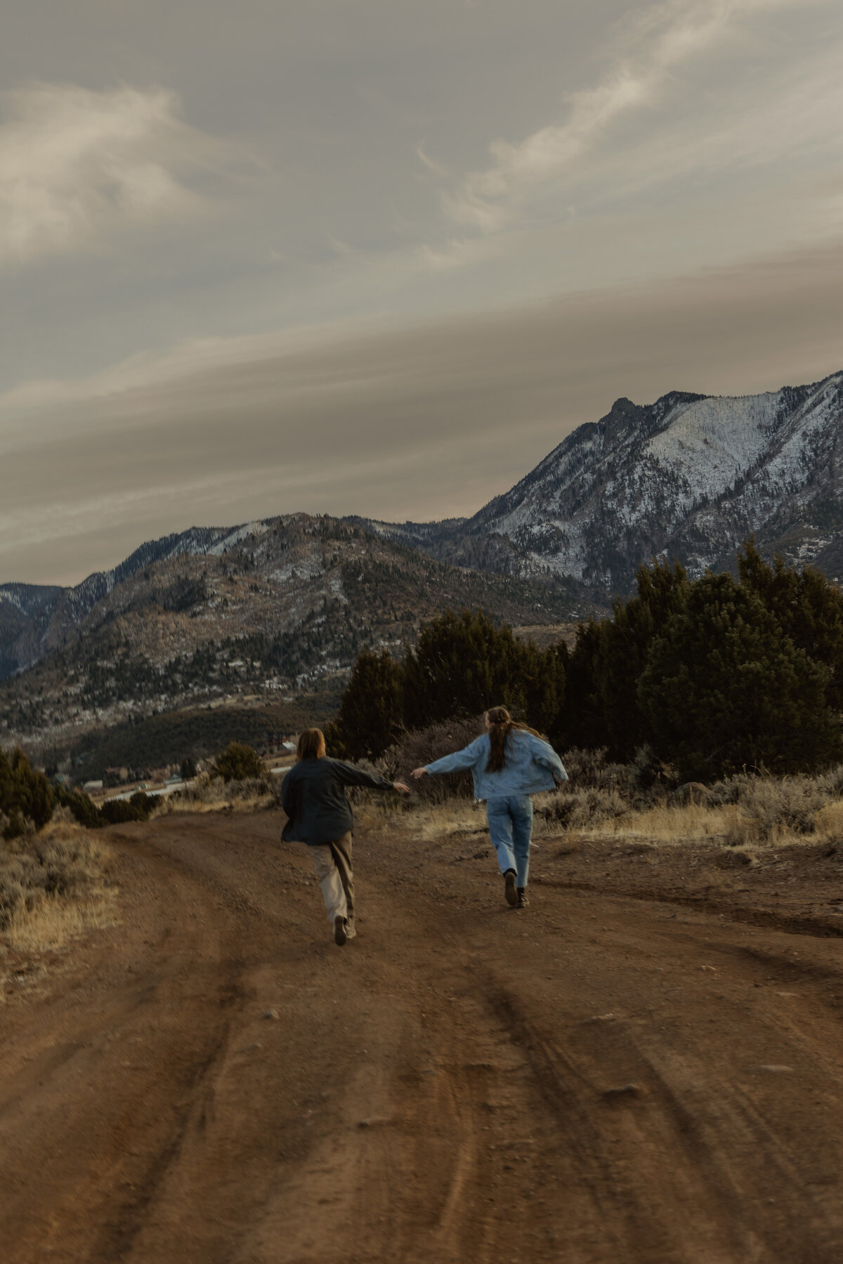 Adventure Couple Running Through the Mountains | UT Couples Photographer 