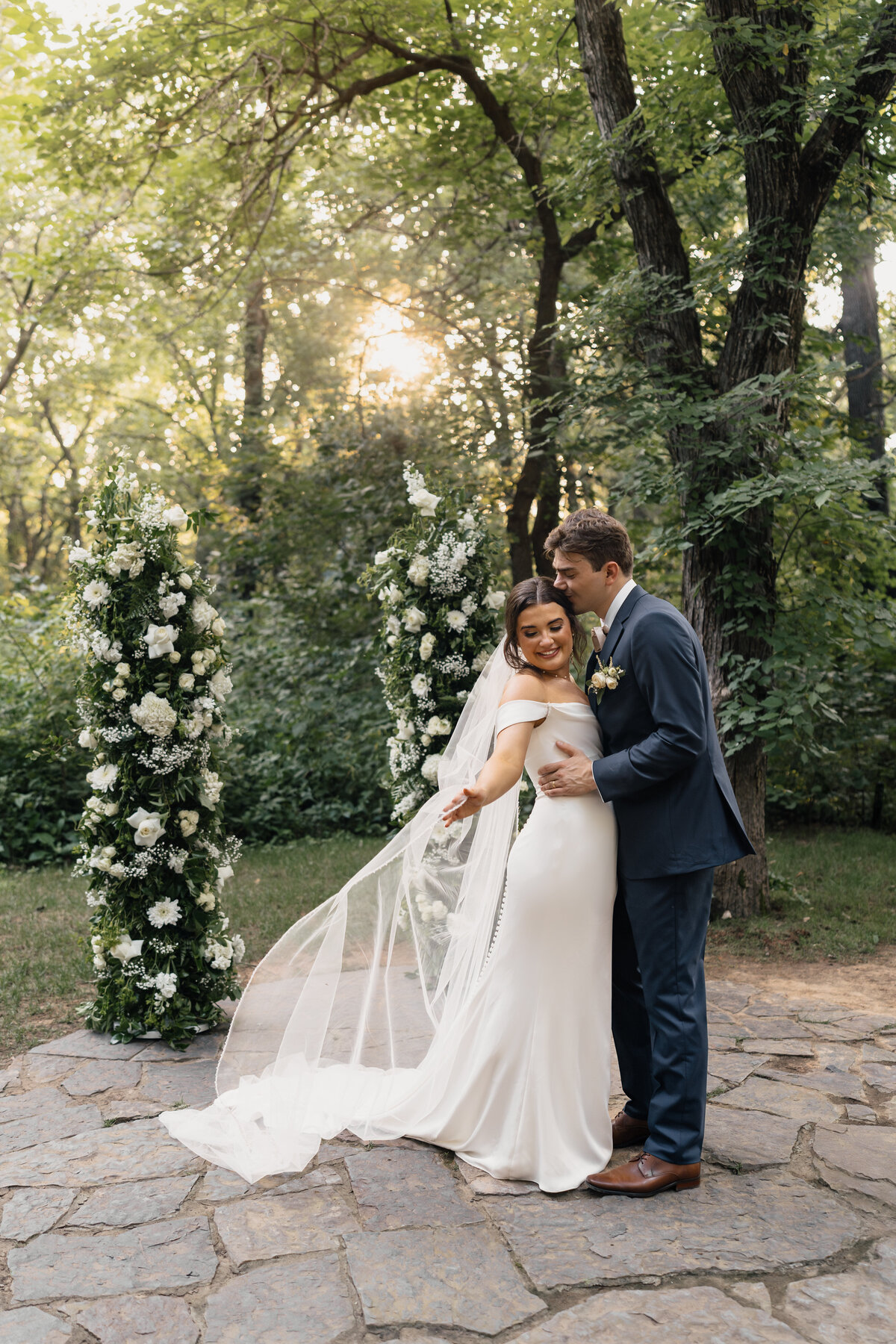 Sunset wedding portraits of the couple at a stunning Tulsa outdoor wedding venue.