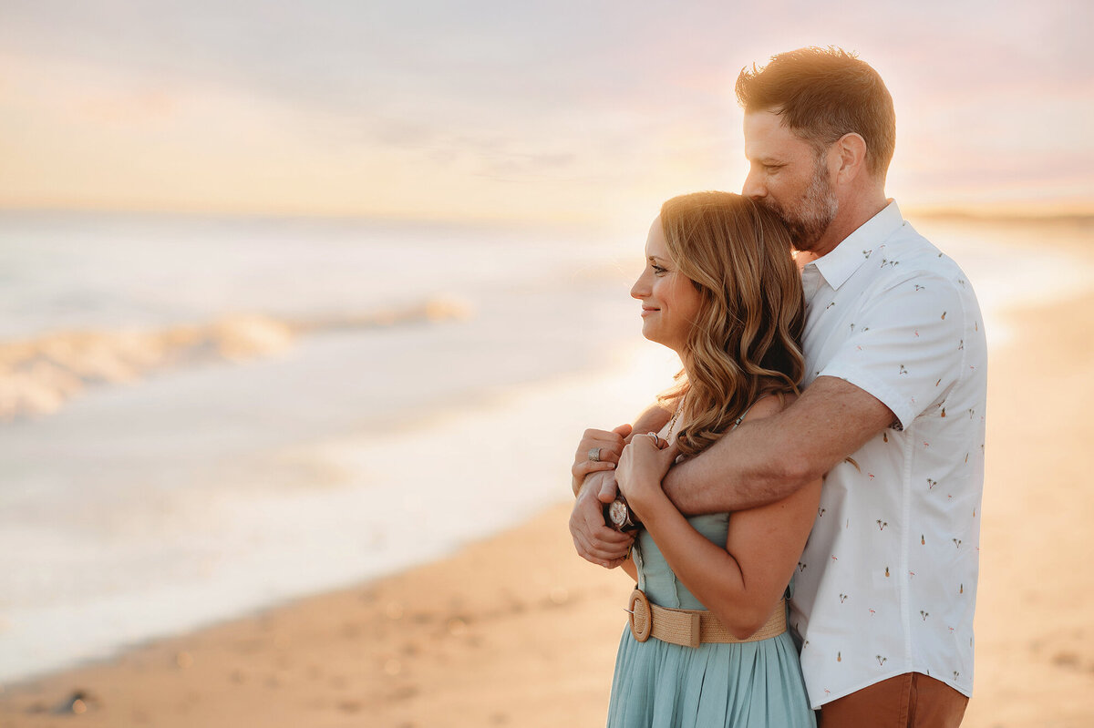 Couple kisses during Family Photo Session in Isle of Palms.