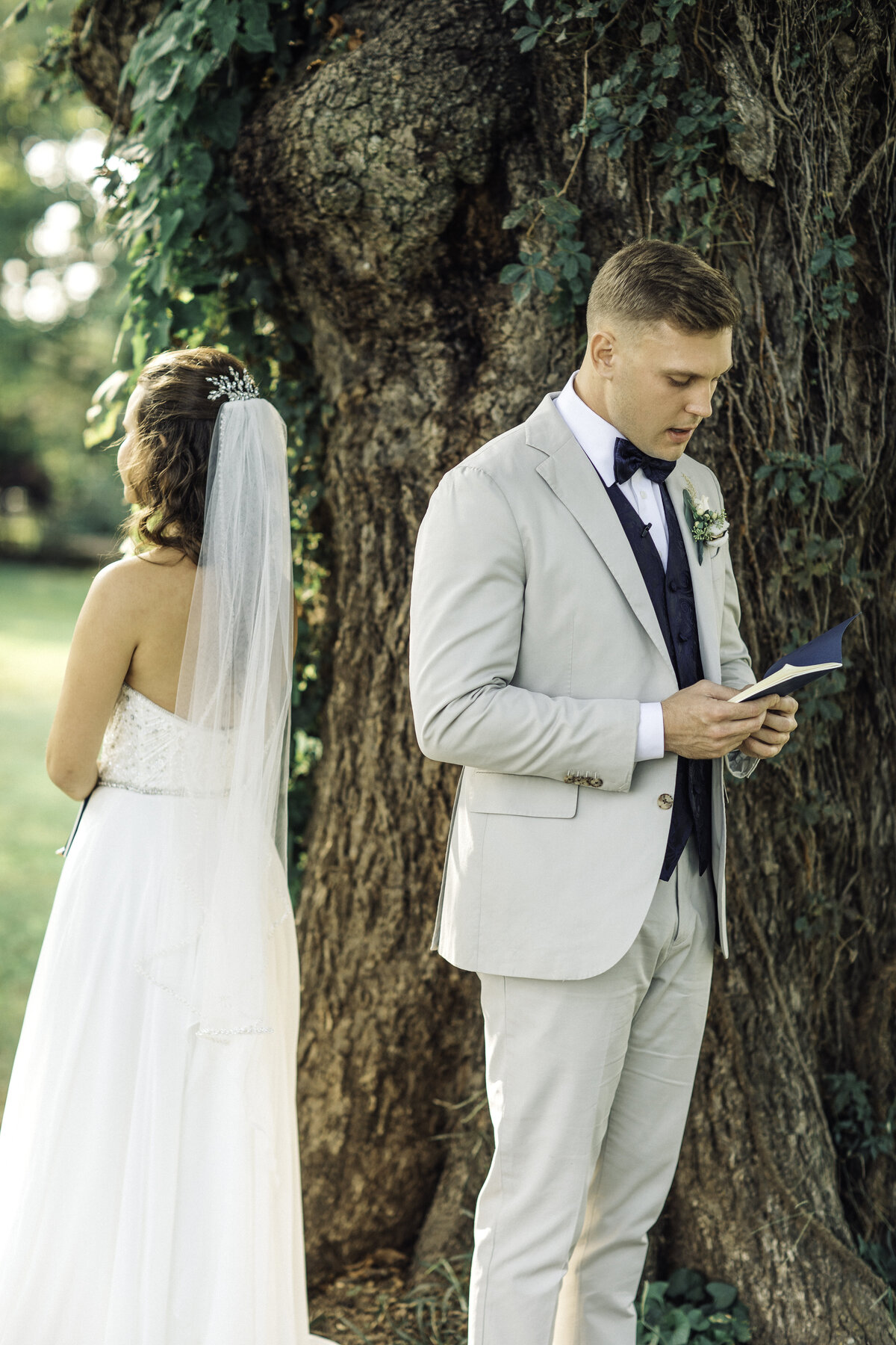 Wedding Photograph Of Groom Holding a Booklet Los Angeles
