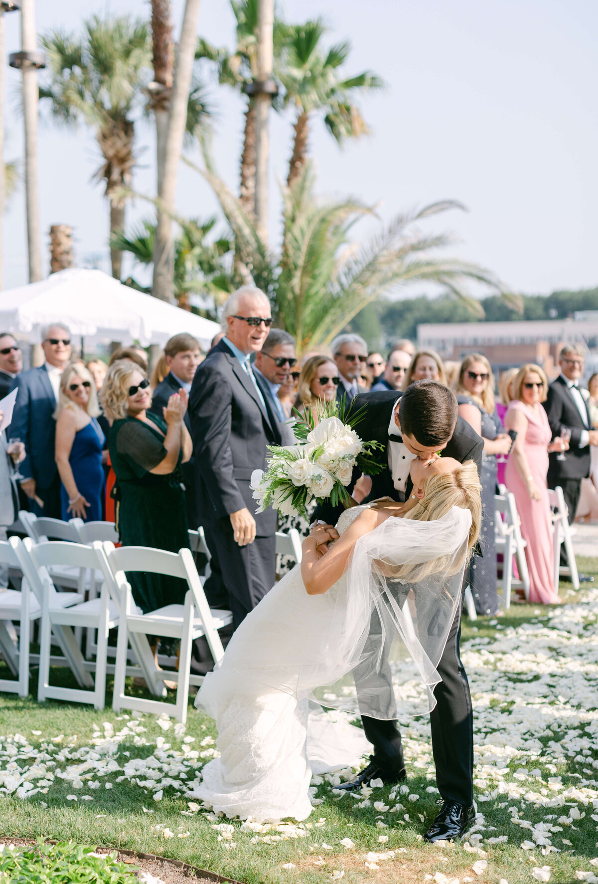 A groom dips his bride.