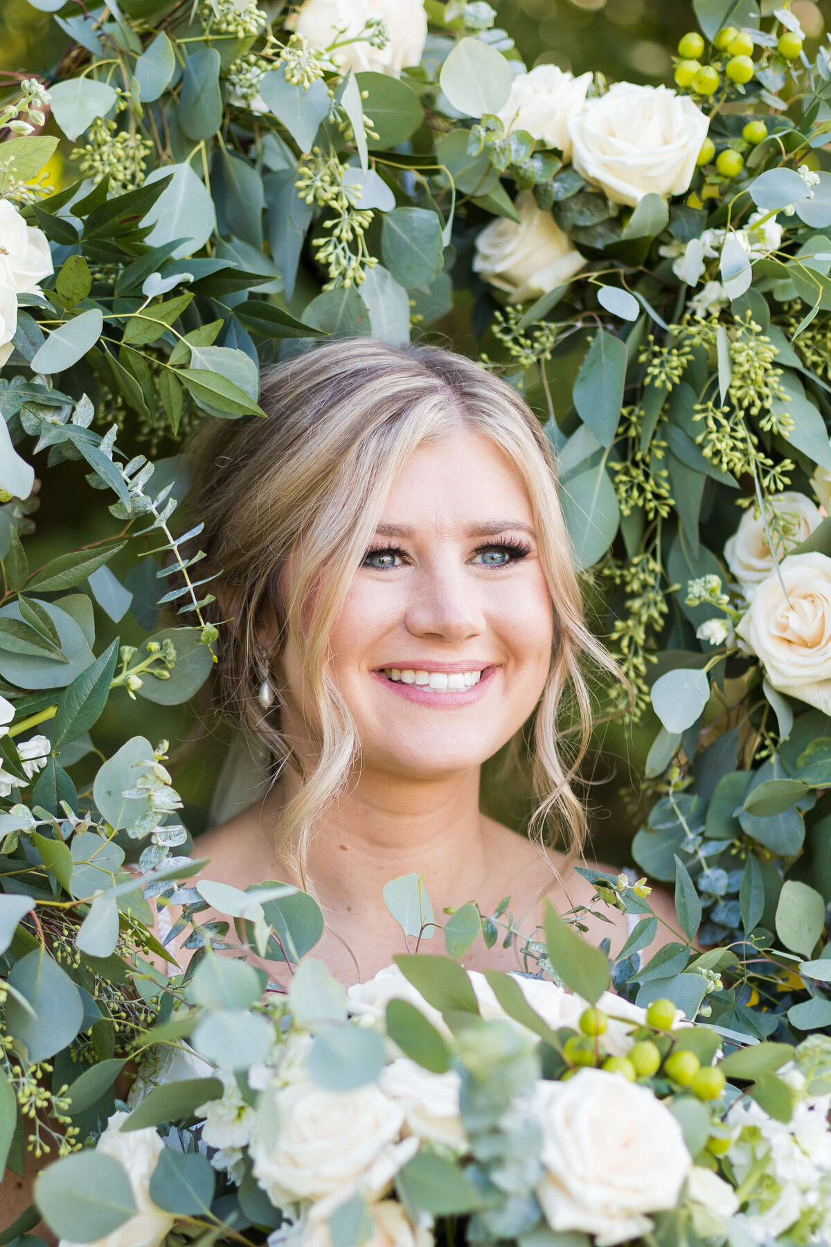 Bride surrounded by florals at  The Barn at White Oaks, Murray, Kentucky
