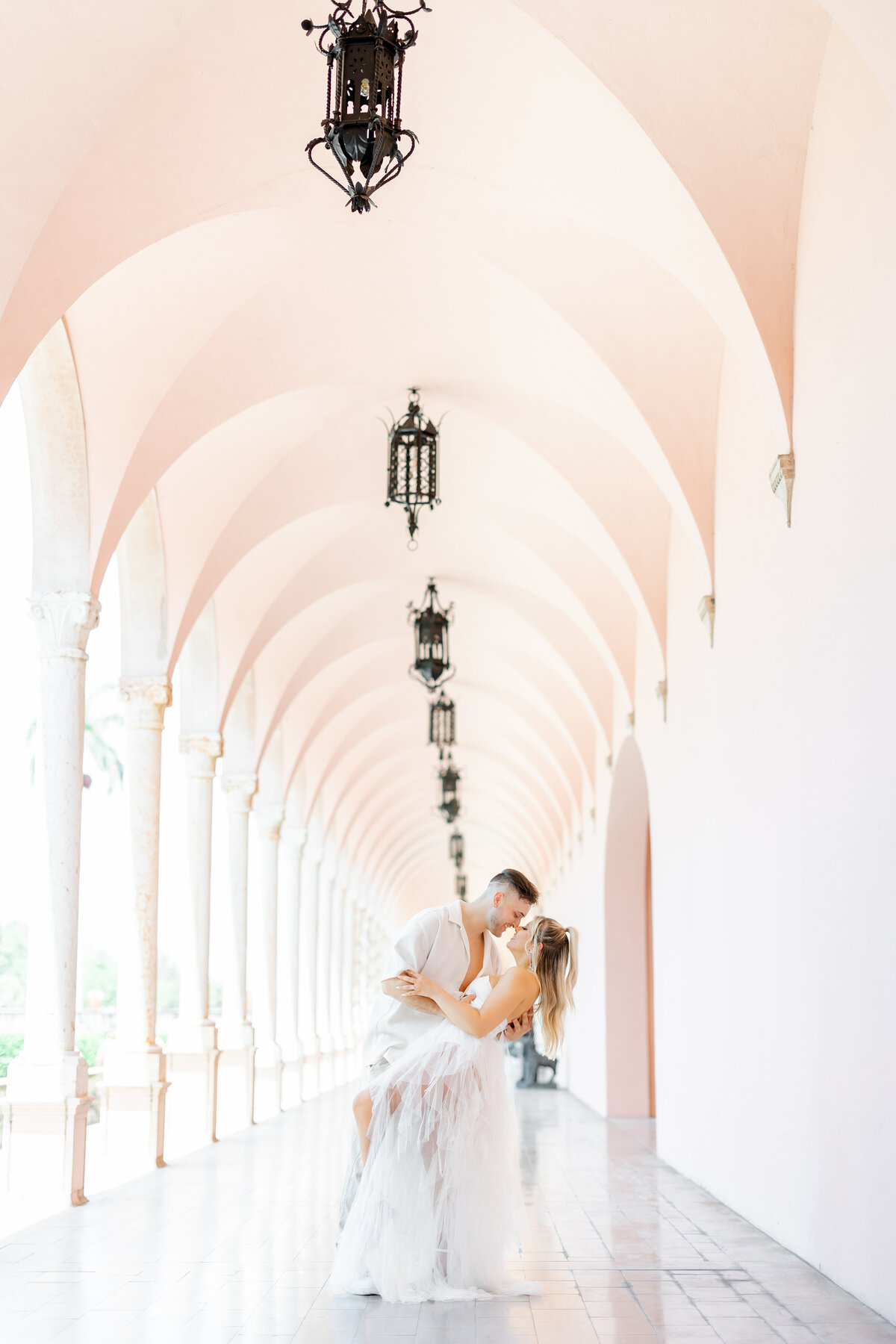 couple under arches at the risling taken by wedding photographers in orlando