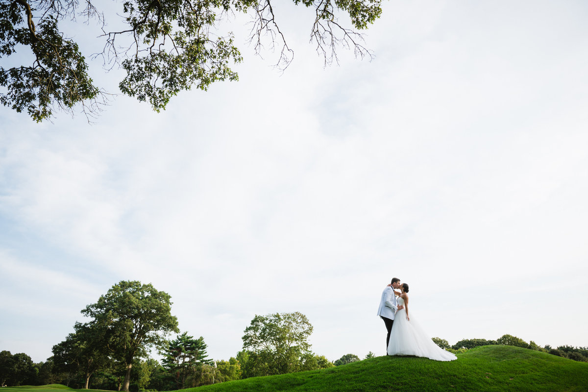 bride and groom on beautiful golf course are The Muttontown Club