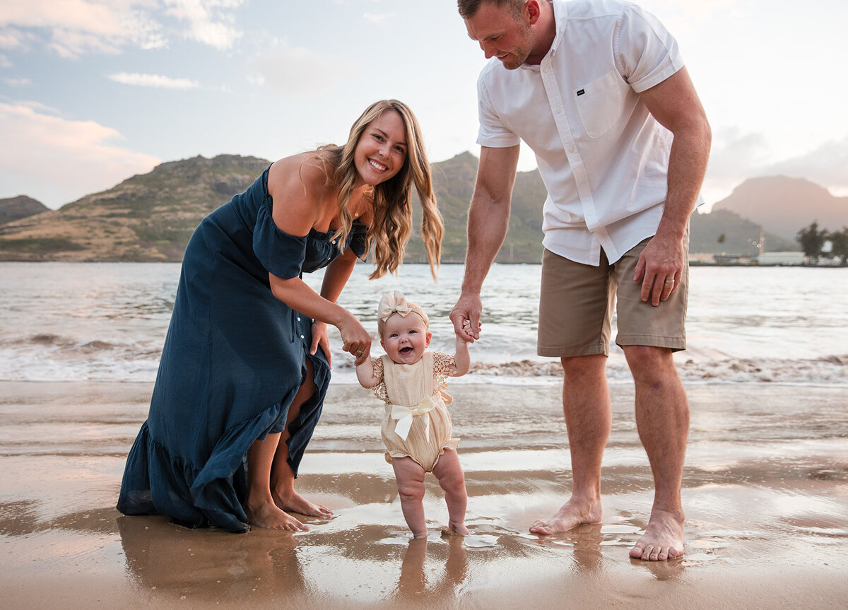 baby playing with parents