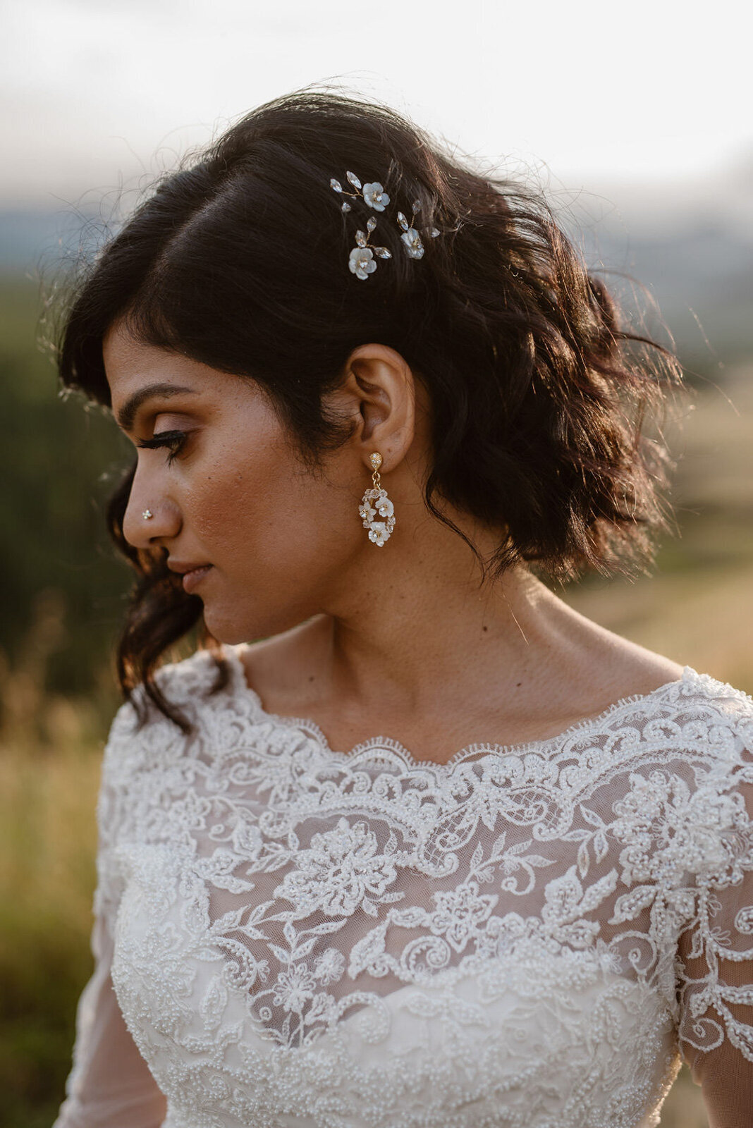 Stunning gold bridal earrings with white flowers, by Joanna Bisley Designs, romantic and modern wedding jeweller based in Calgary, Alberta. Featured on the Brontë Bride Vendor Guide.