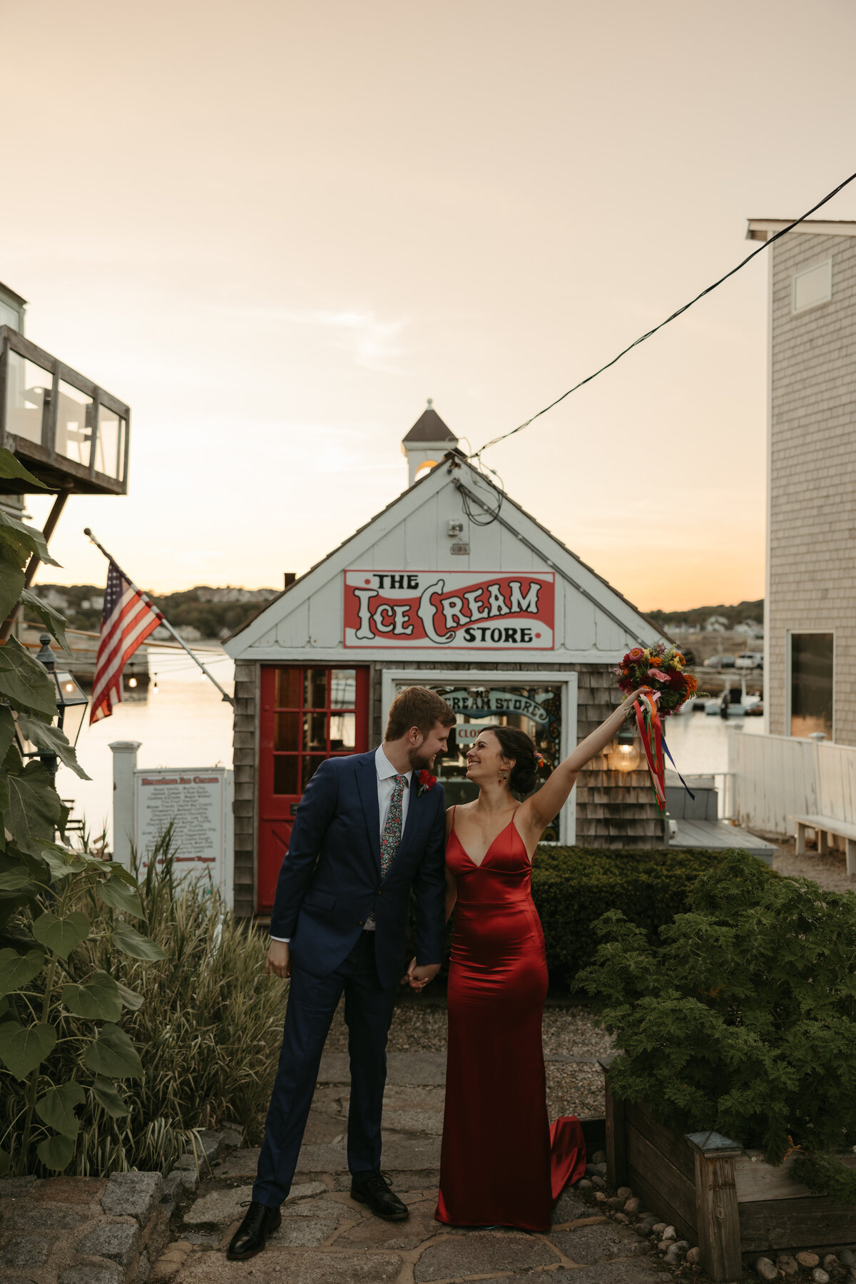 Red dress wedding dress with colorful florals by Boston Florist, Prose Florals captured by Caroline Giuliano photography