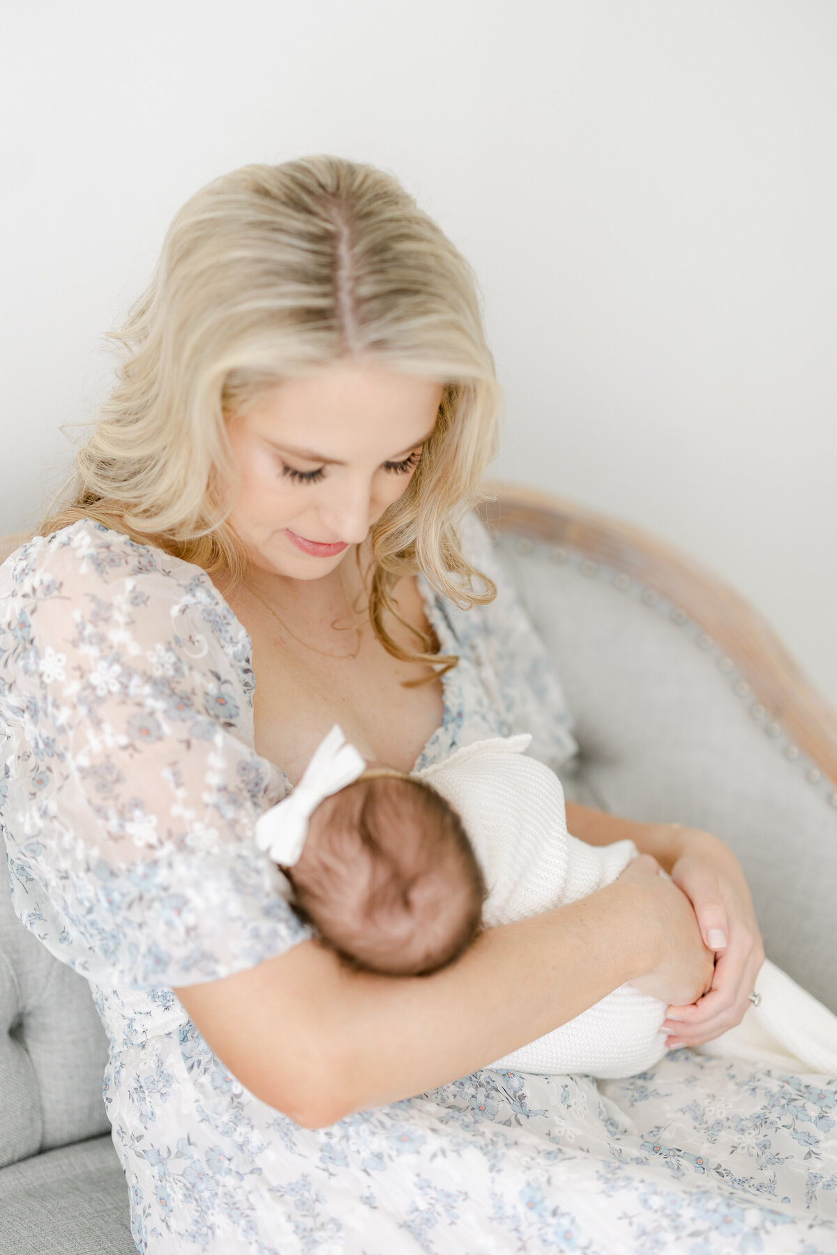 a mom holding her newborn baby