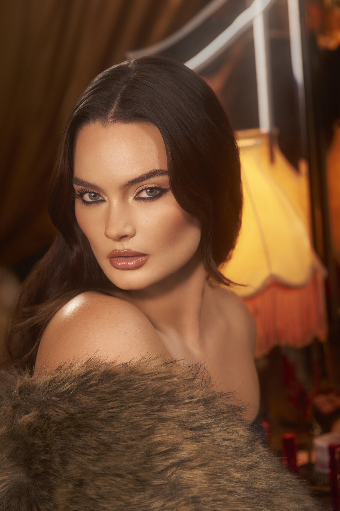 Caitlin Lawson wearing elegant makeup for the Charlotte Tilbury campaign, with vibrant tones, shot by Ylva Erevall.