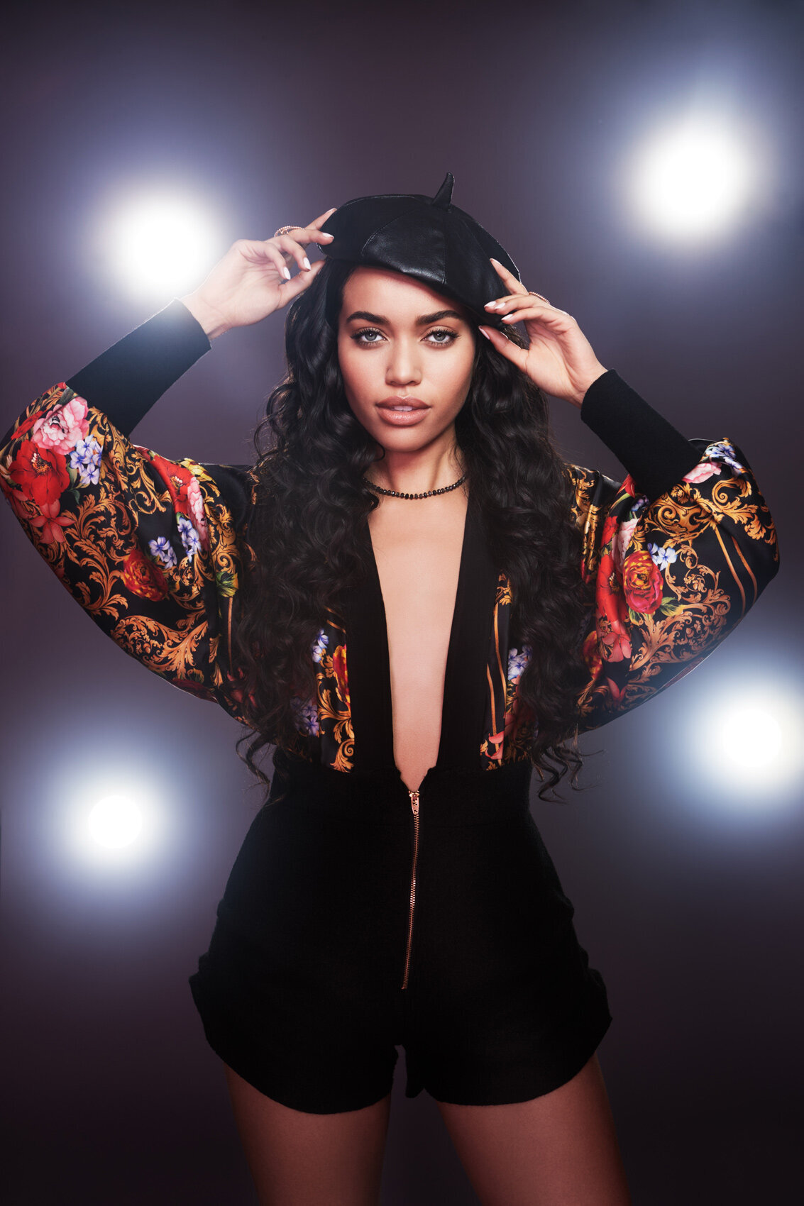 Dynamic portrait of Sena in a striking outfit with a powerful expression, shot by Ylva Erevall.