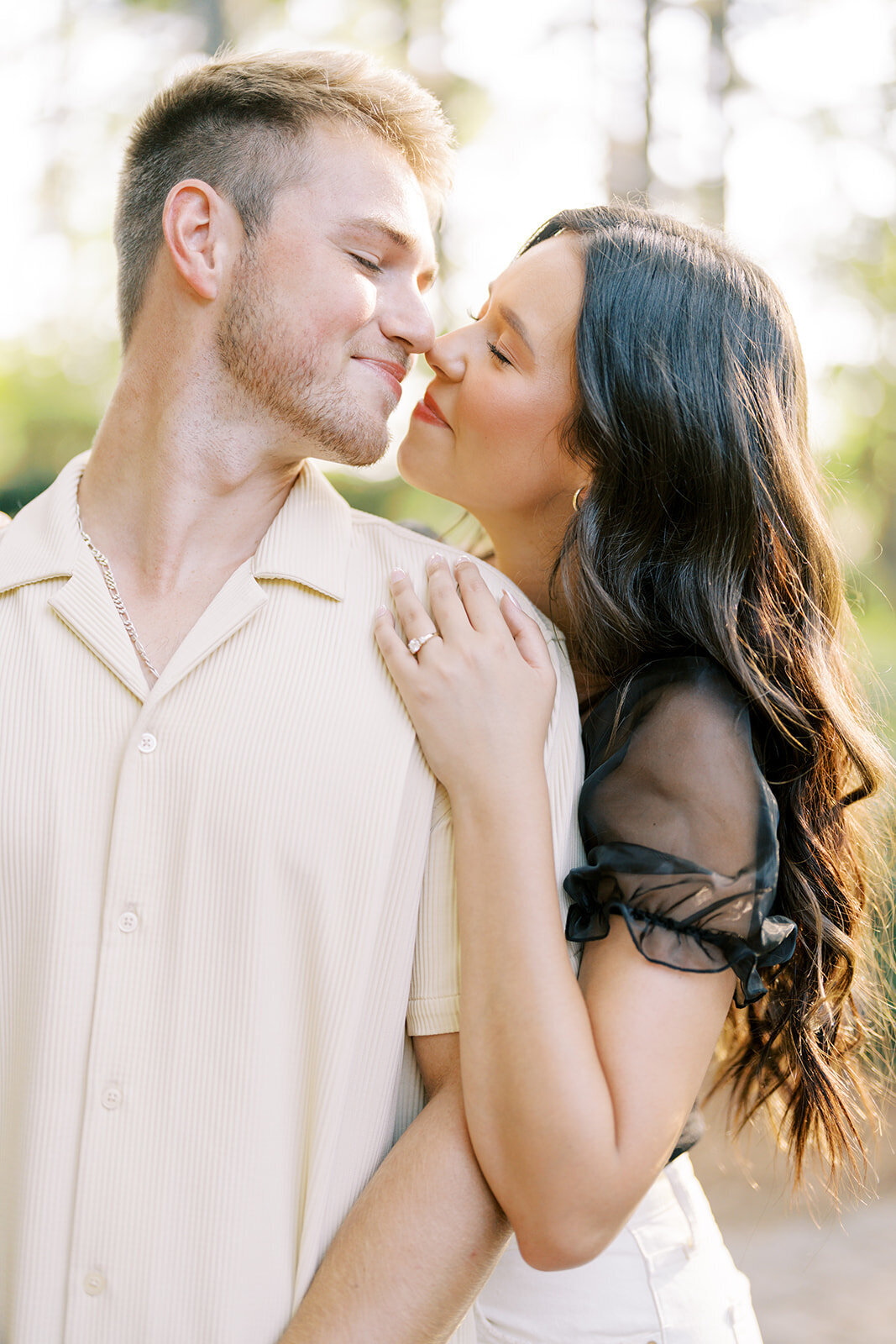 A romantic summer engagement portrait at WRAL Azalea Gardens in downtown Raleigh, North Carolina, captured by North Carolina wedding photographer Jessica Leigh Mason.