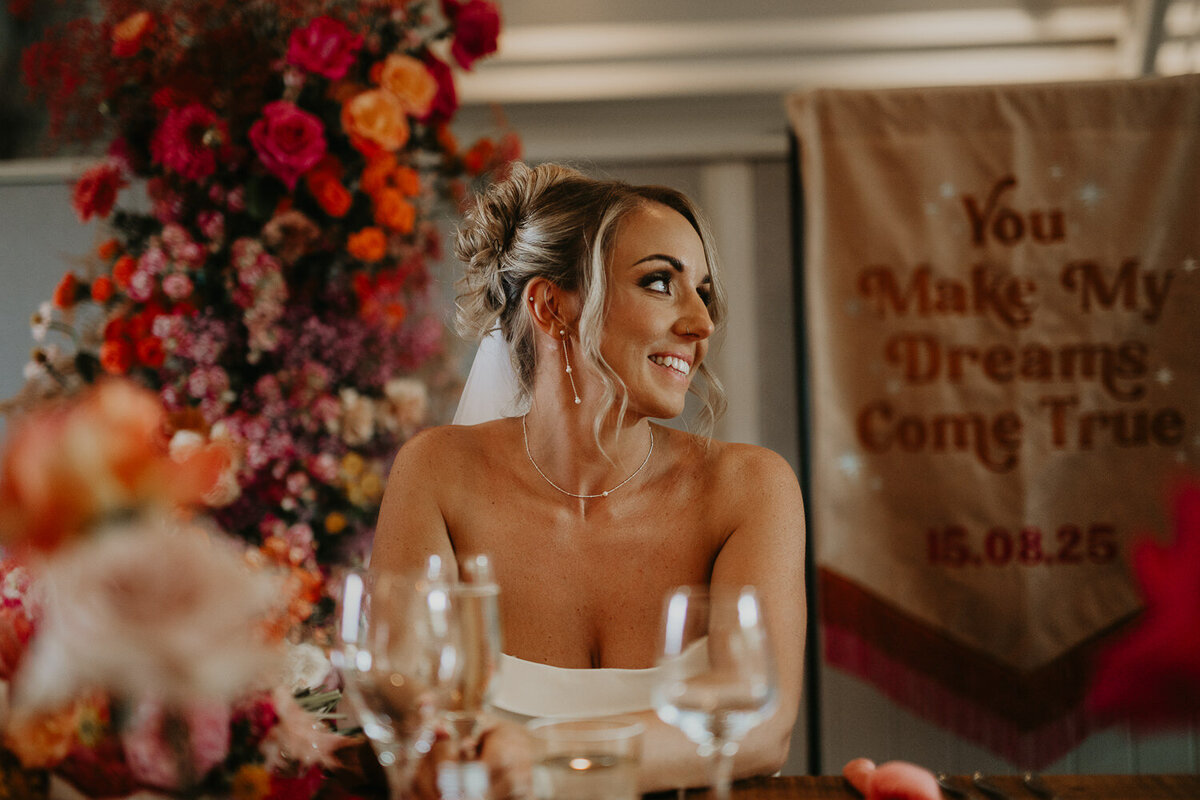 Bride reacts to grooms speech at Lapstone Barn. 