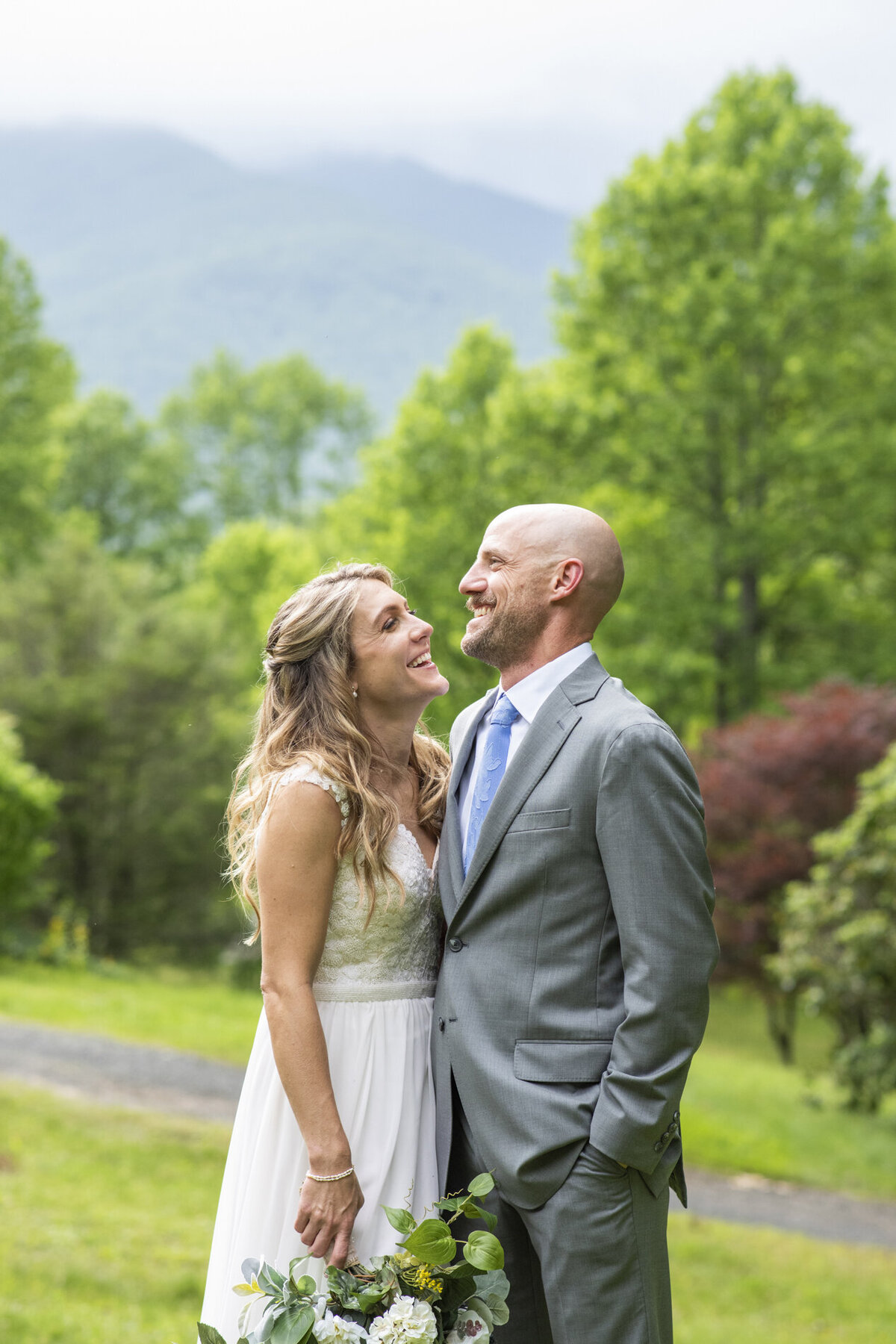 Couple laughing during wedding photos at Mount Mitchell Eco Retreat