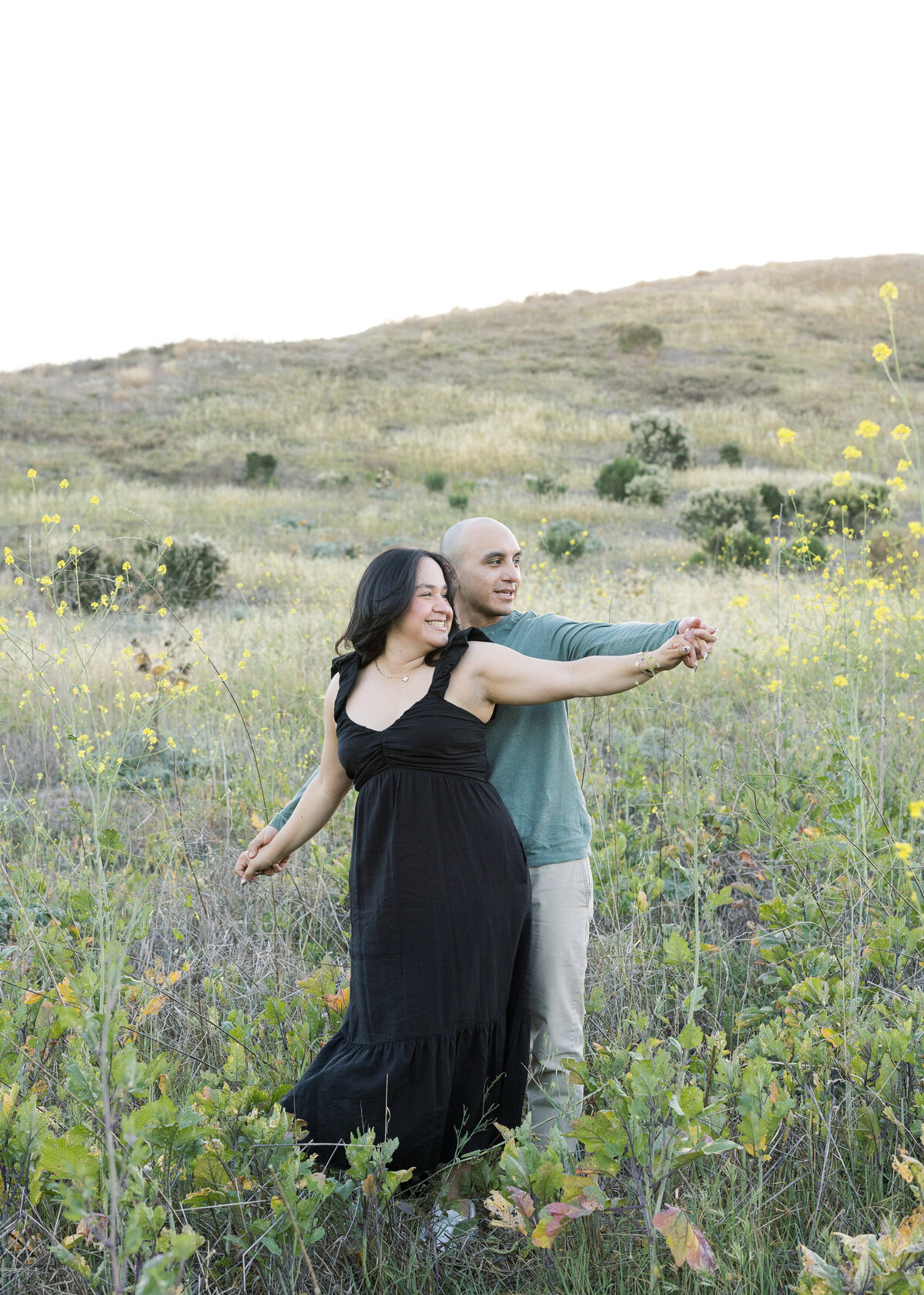 candid couple photo in open field