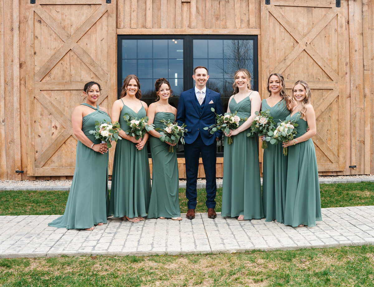 Bride and groom walking hand in hand at their outdoor New England wedding