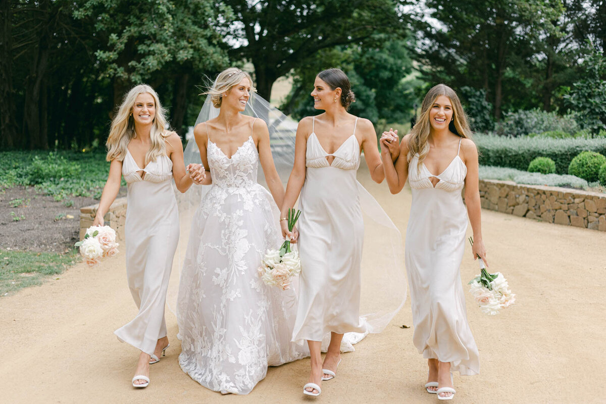 bride with her bridesmaids