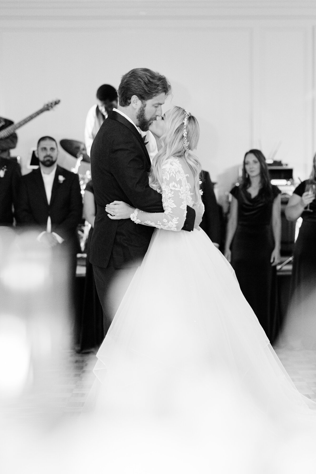 Bride and groom share their first dance during a luxury wedding reception at Sea Pines, Hilton Head Island—captured in timeless black-and-white by editorial wedding photographer Amia Marcell.