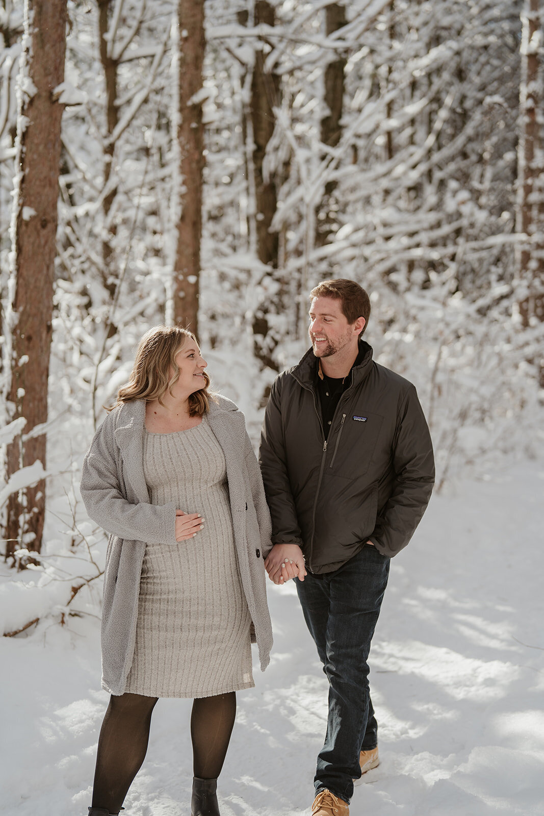 a couple walking together during their maternity session at Al Sabo