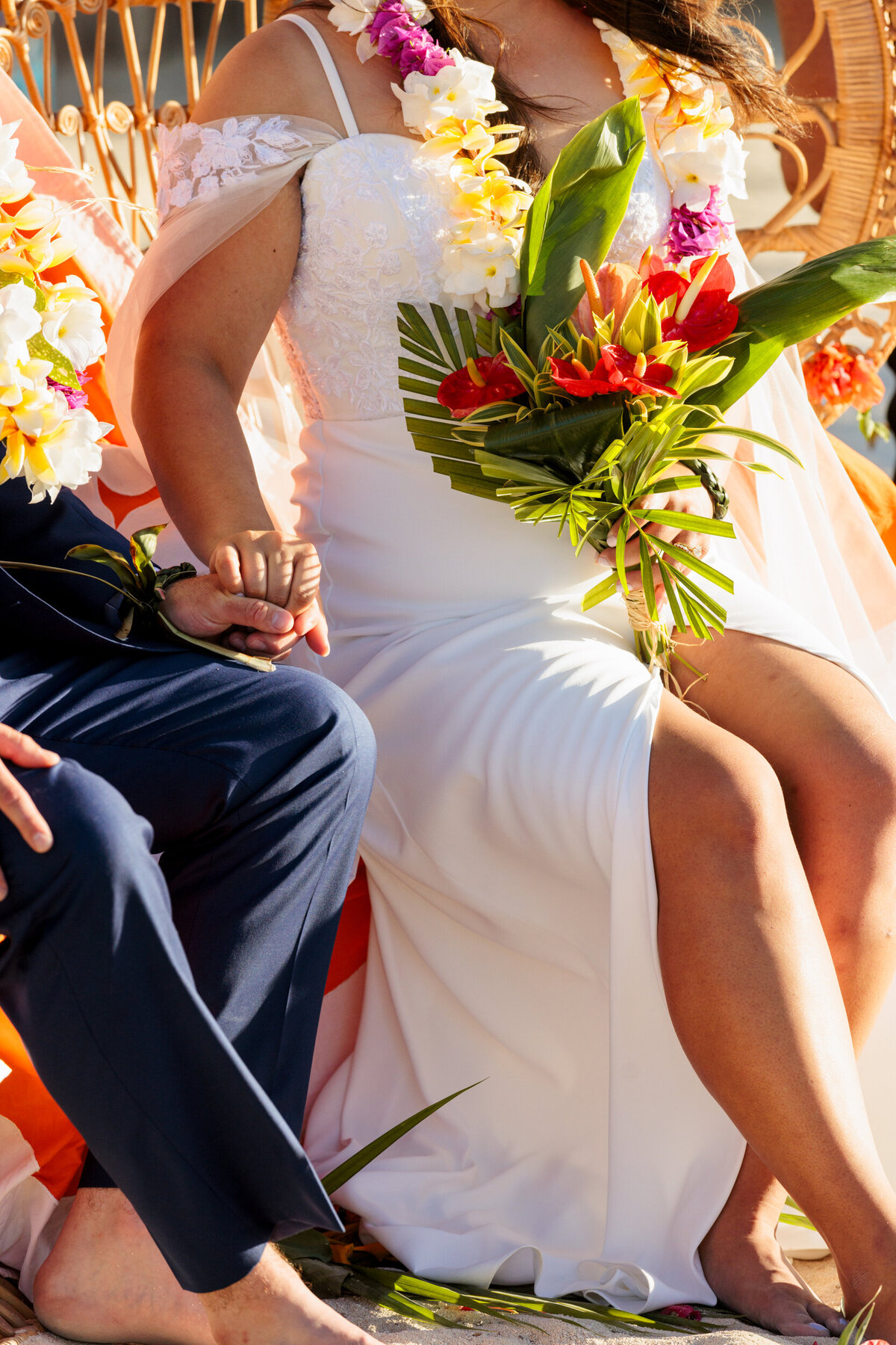 couple-holds-hands-hilton-moorea-destination-wedding