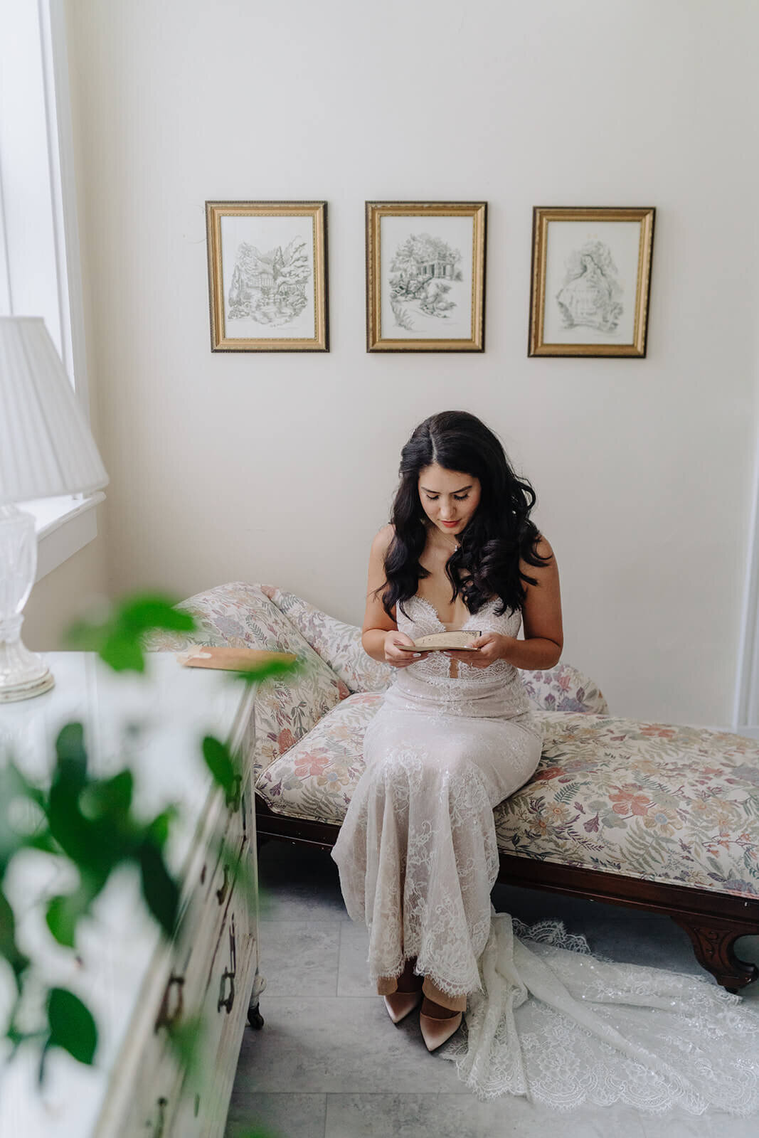 Bride sitting down reading letter