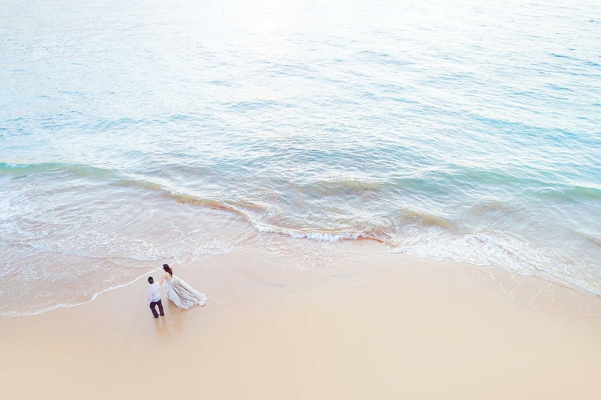 Drone portrait of a trash the dress session on Maui photographed in Wailea by Love + Water
