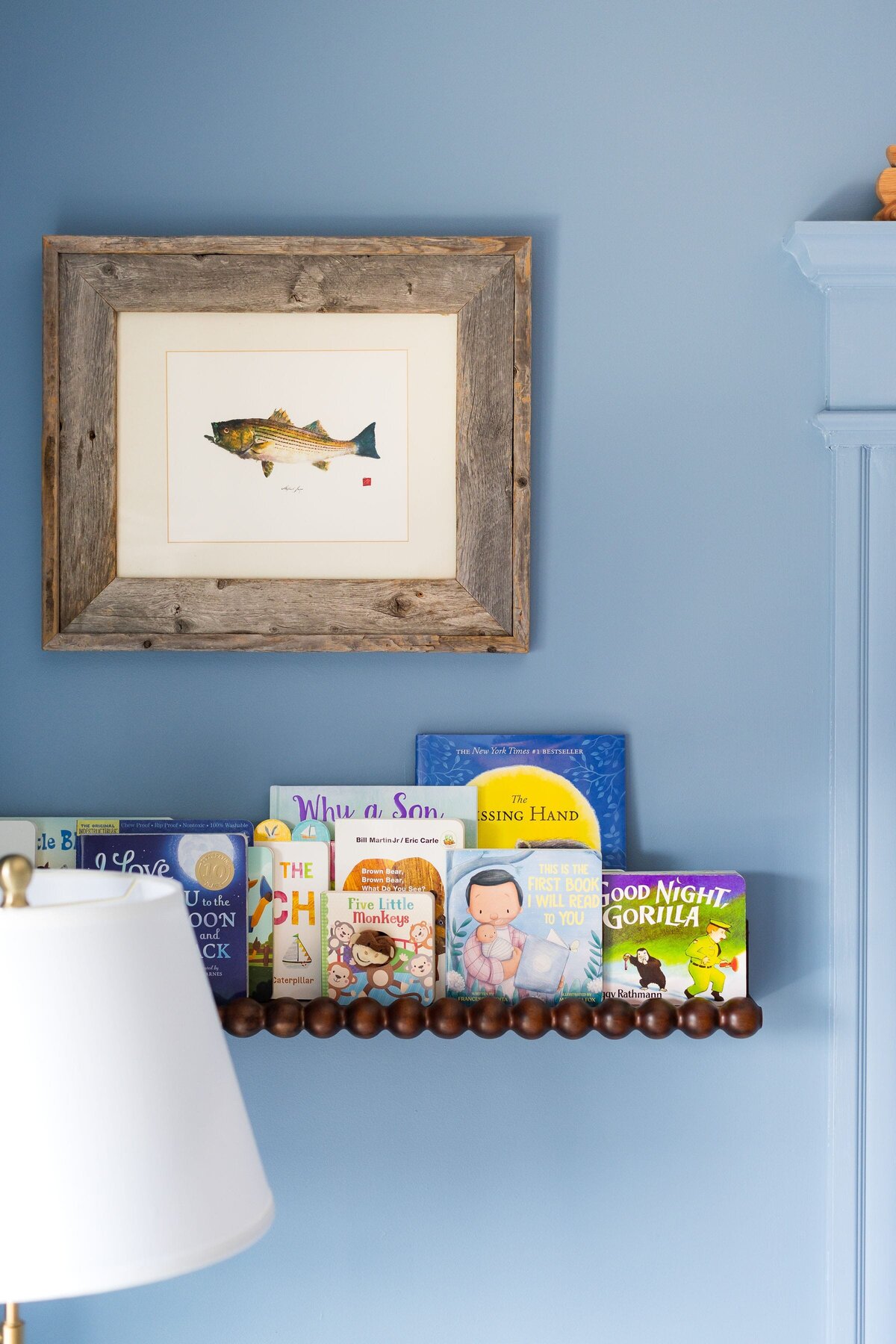 melinda chesson interiors west 7th street nursery fish framed artwork with book shelf
