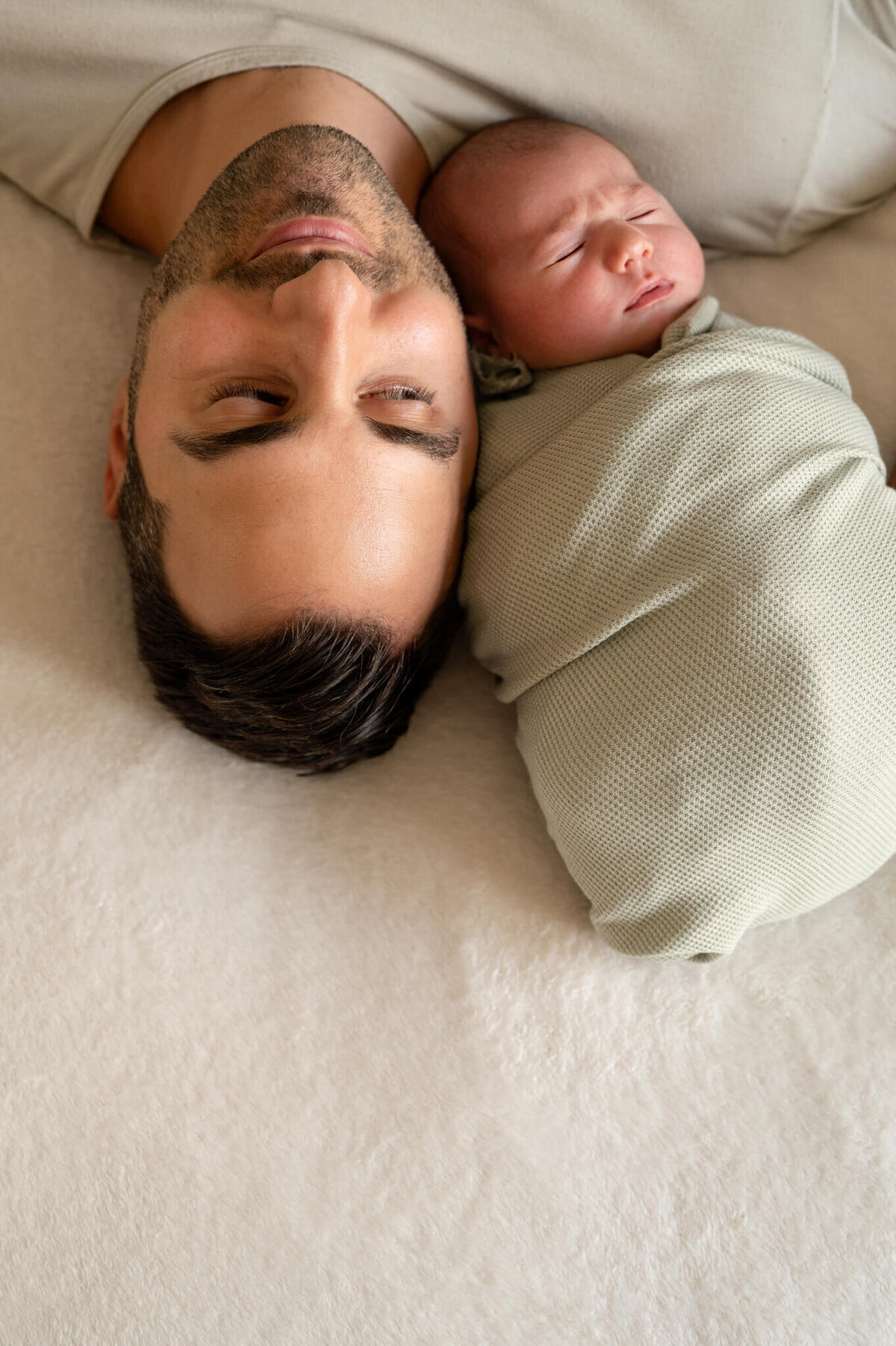Dad's face near newborn