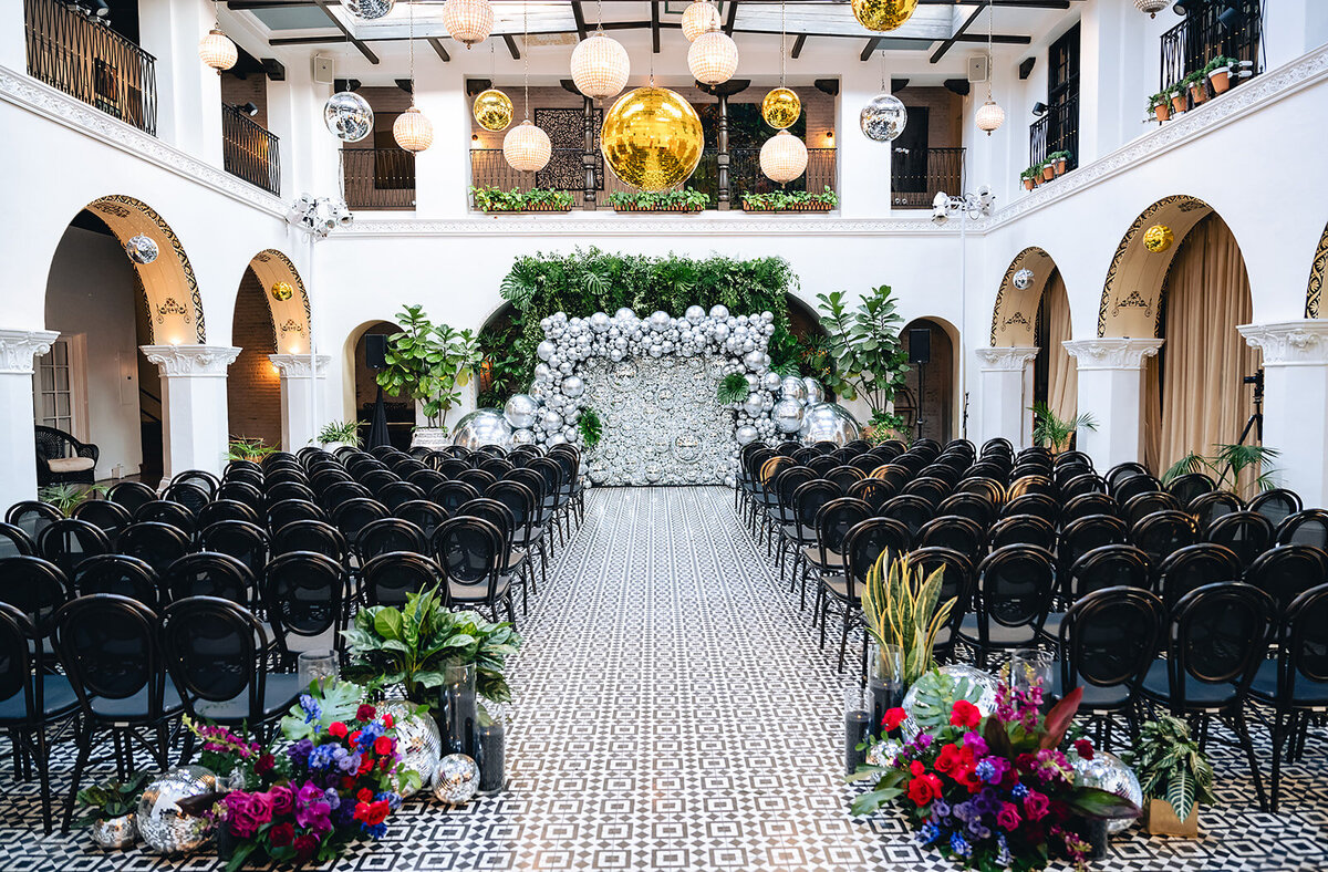 Disco ball wedding ceremony backdrop at The Ebell of Long Beach 