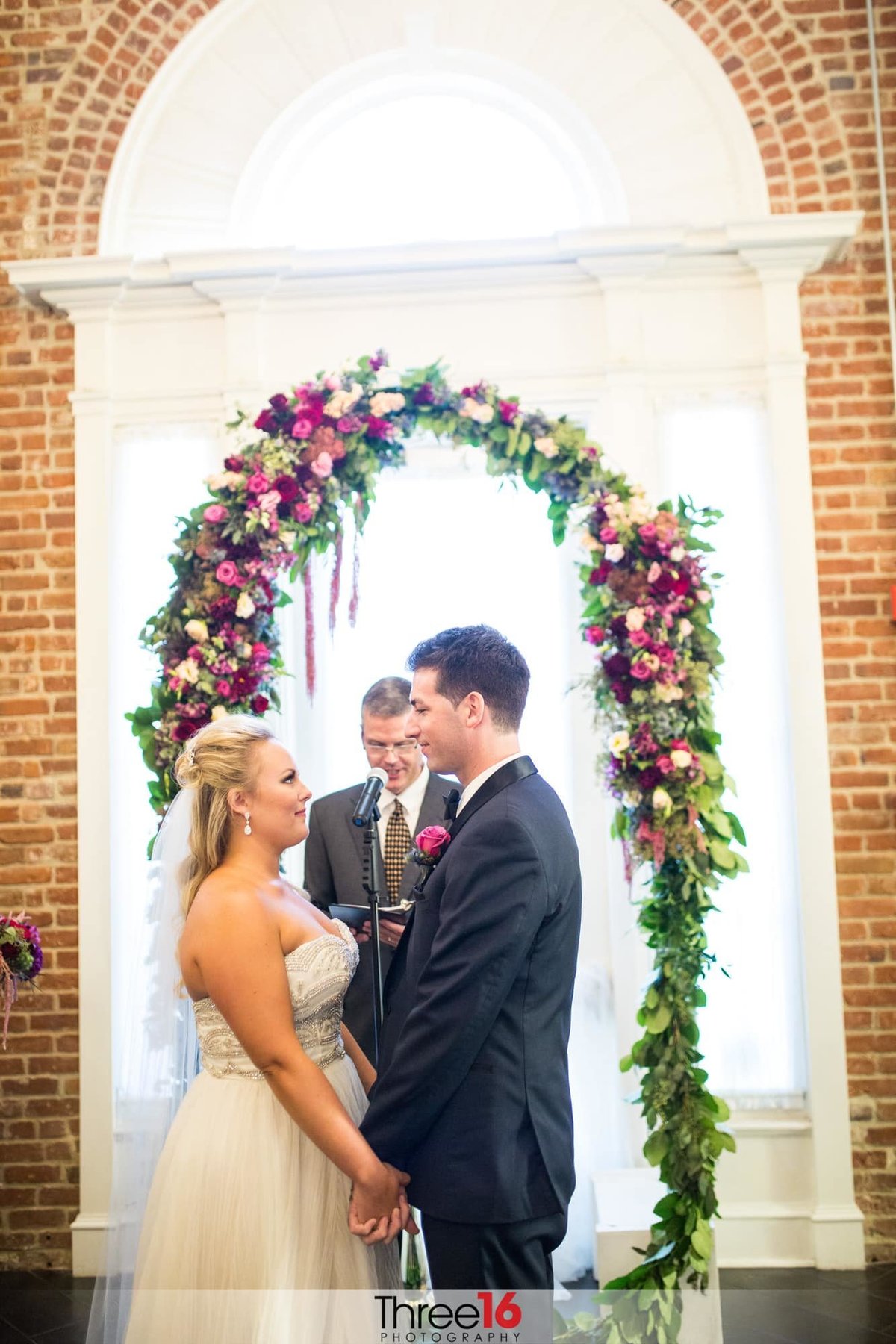 Bride and Groom look into each other's eyes during the ceremony