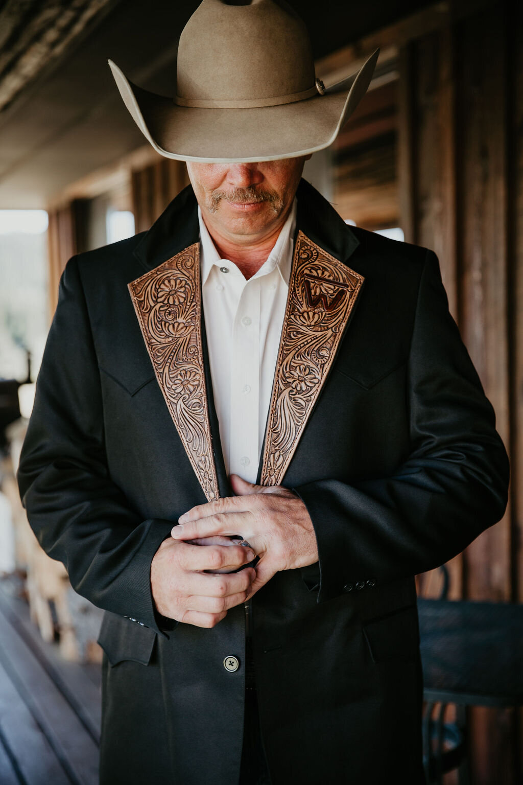 Groom wearing a cowboy hat