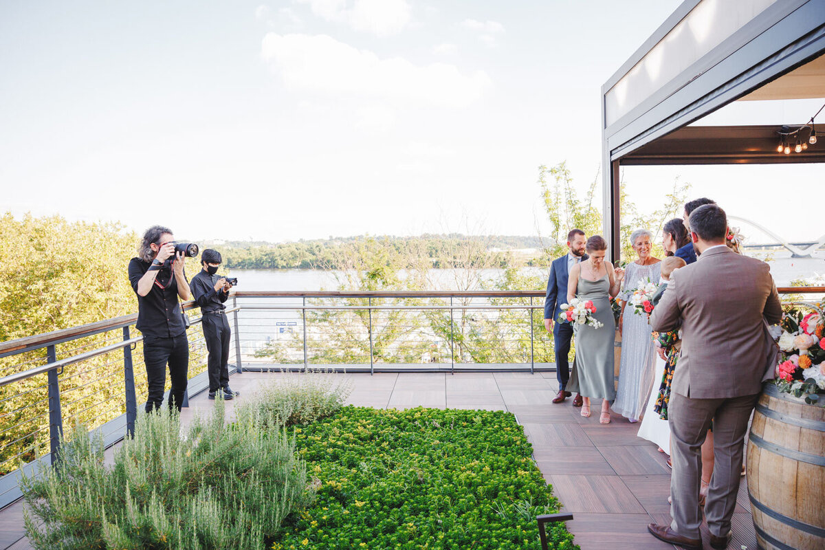 Photographers taking photo of the guests and bridesmaids