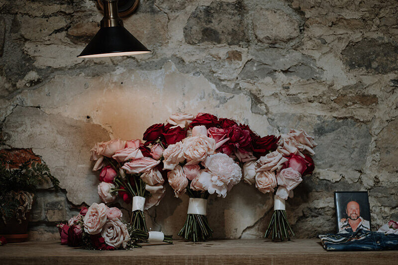 Weddings bouquets full of roses by the little flower hut