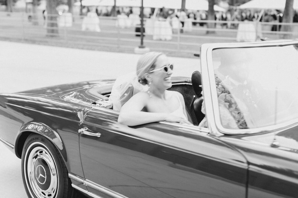 Bride in Getaway Car at Wedding