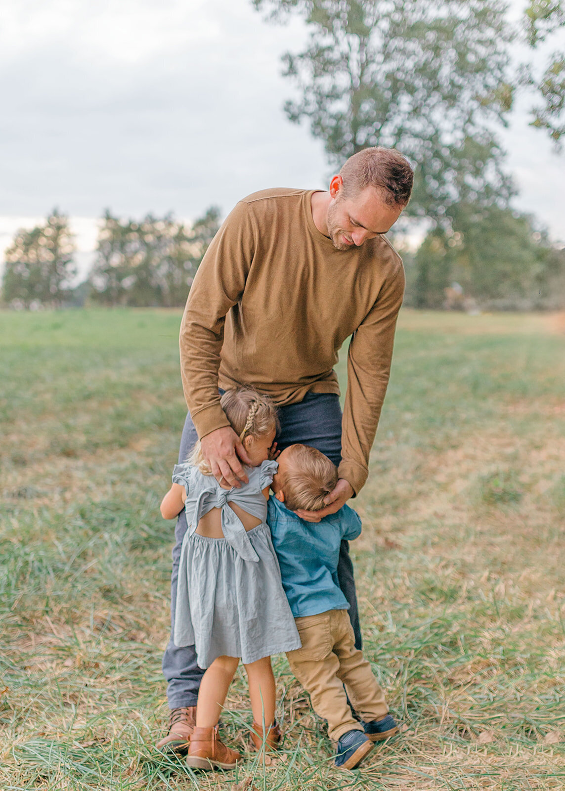 kids hugging dad