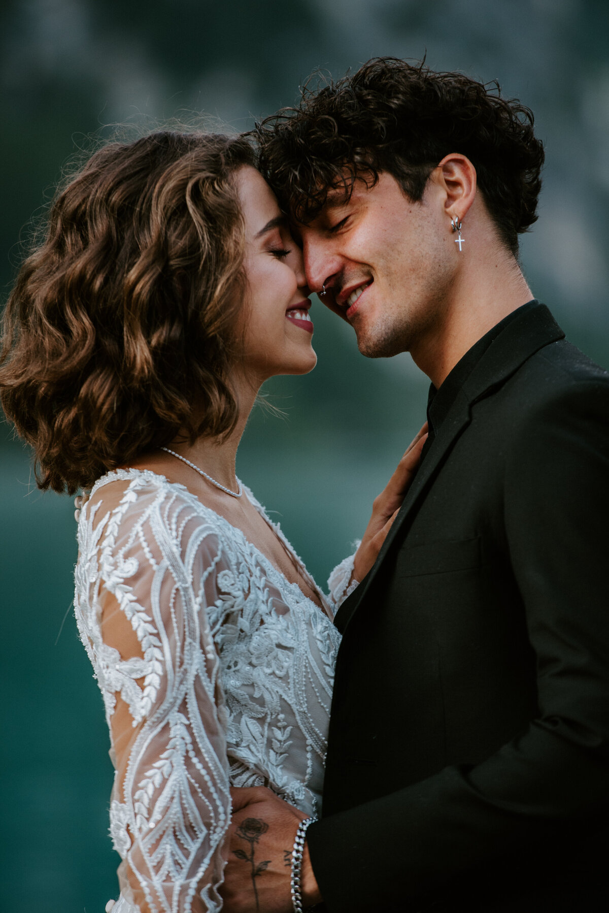 Couple eloping at Lago di Braies  at boathouse La Palafitta