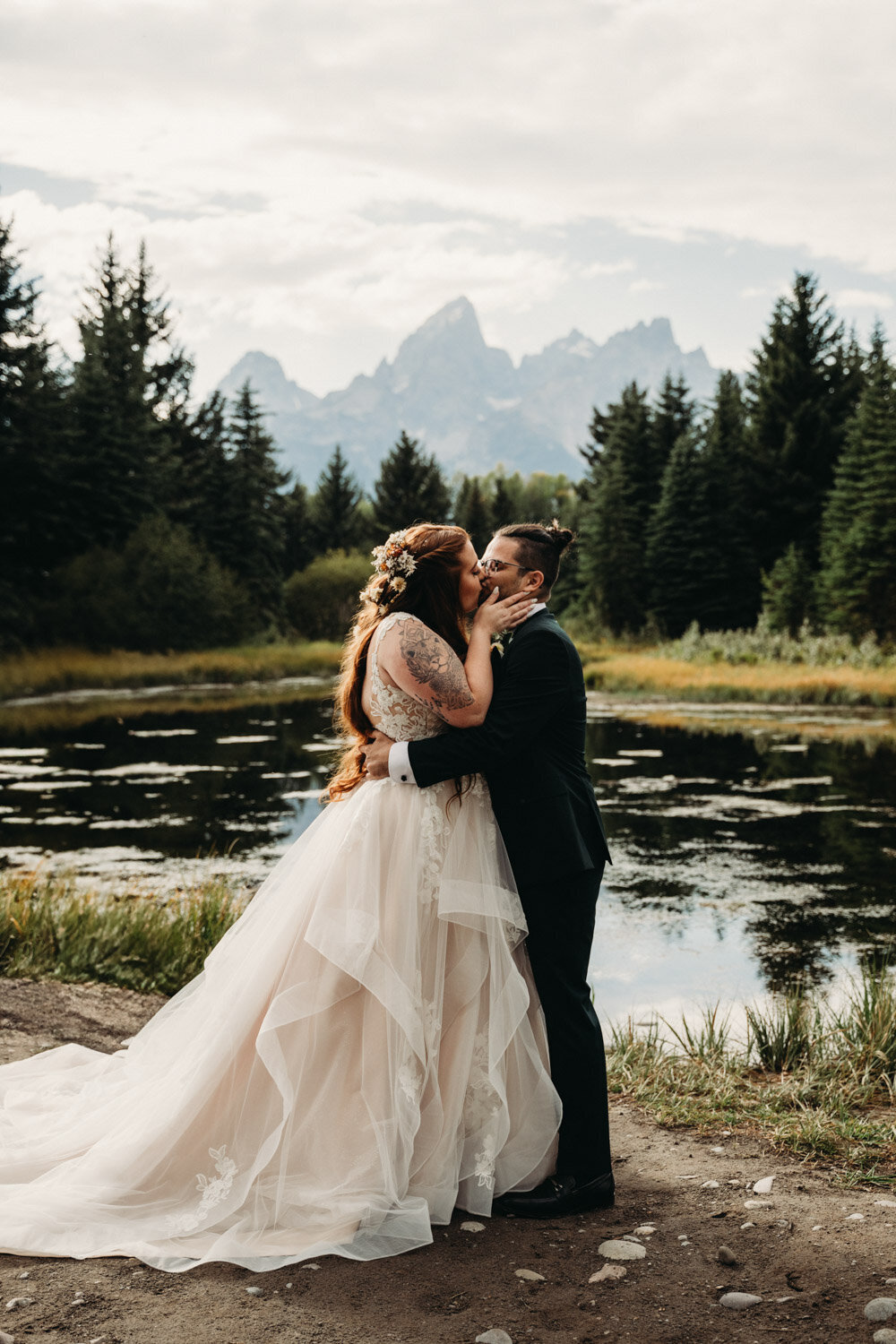 Couple shares their first kiss after ceremony at elopement in wyoming