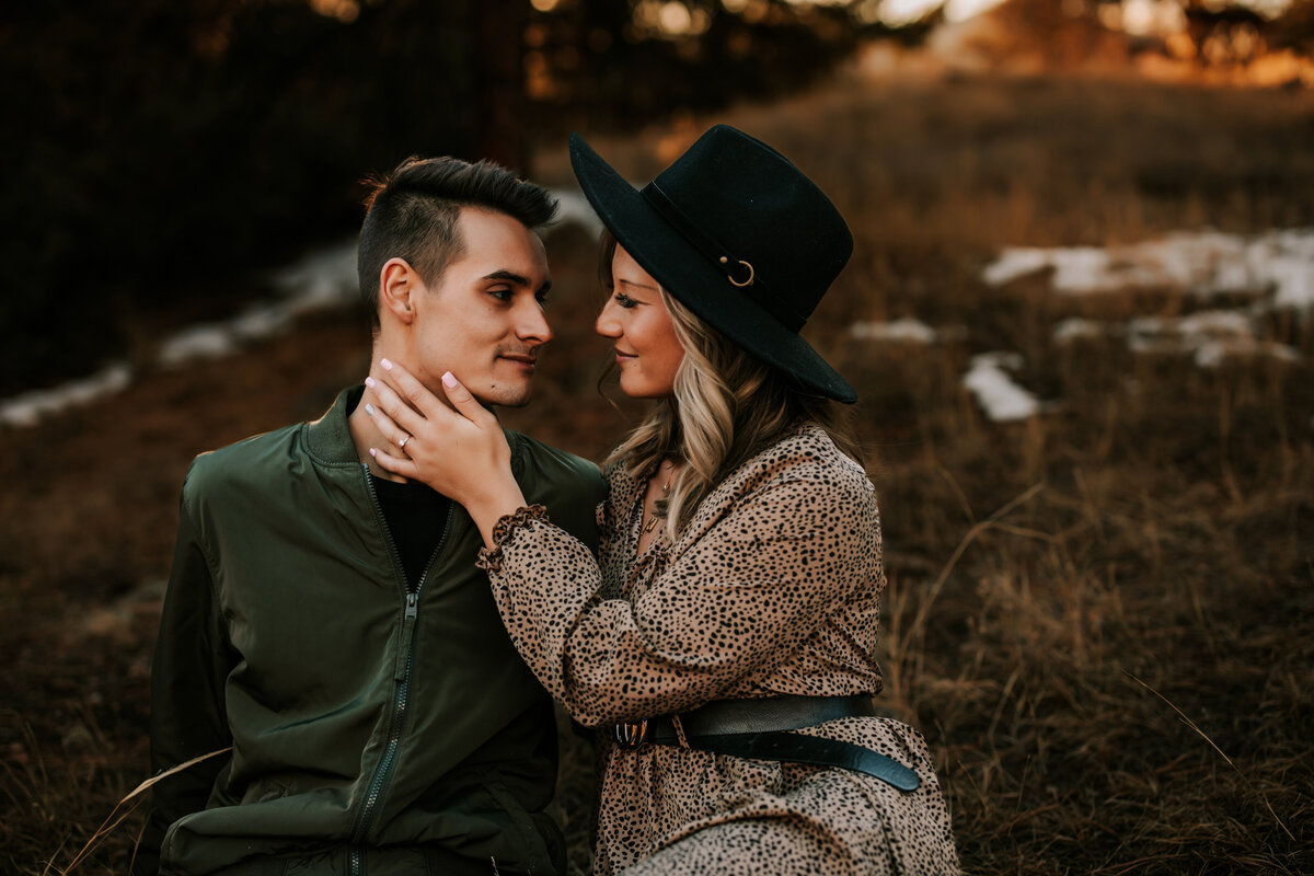 Colorado couple hold eachother in the middle of fall foliage for a couples session