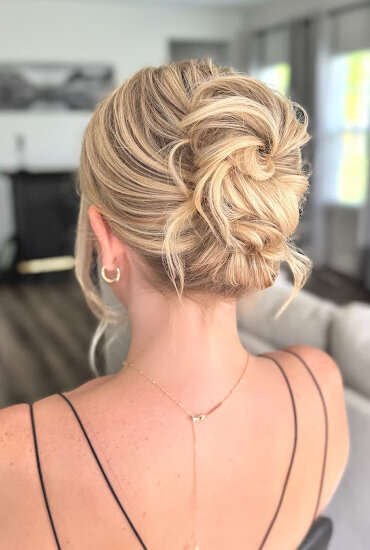 mid bun updo on blonde hair wedding hairstyle bridesmaid hair updo