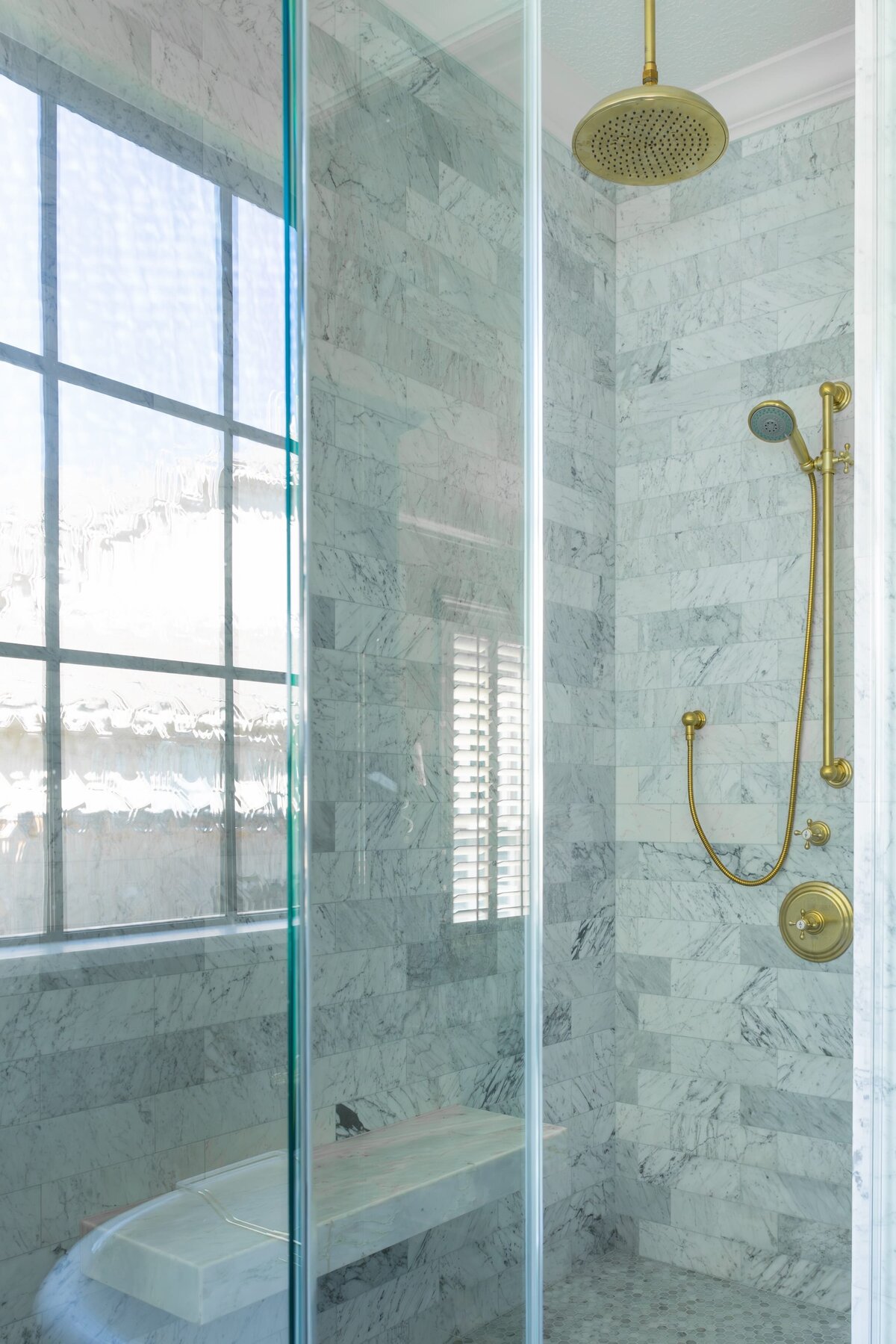 kyleen bushroe interiors coverdell shower with gold faucet and bathroom window