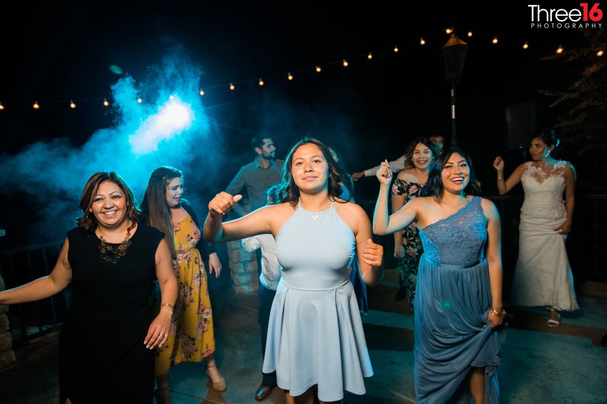 Line dancing at a wedding reception at Serendipity Gardens in Oak Glen, CA