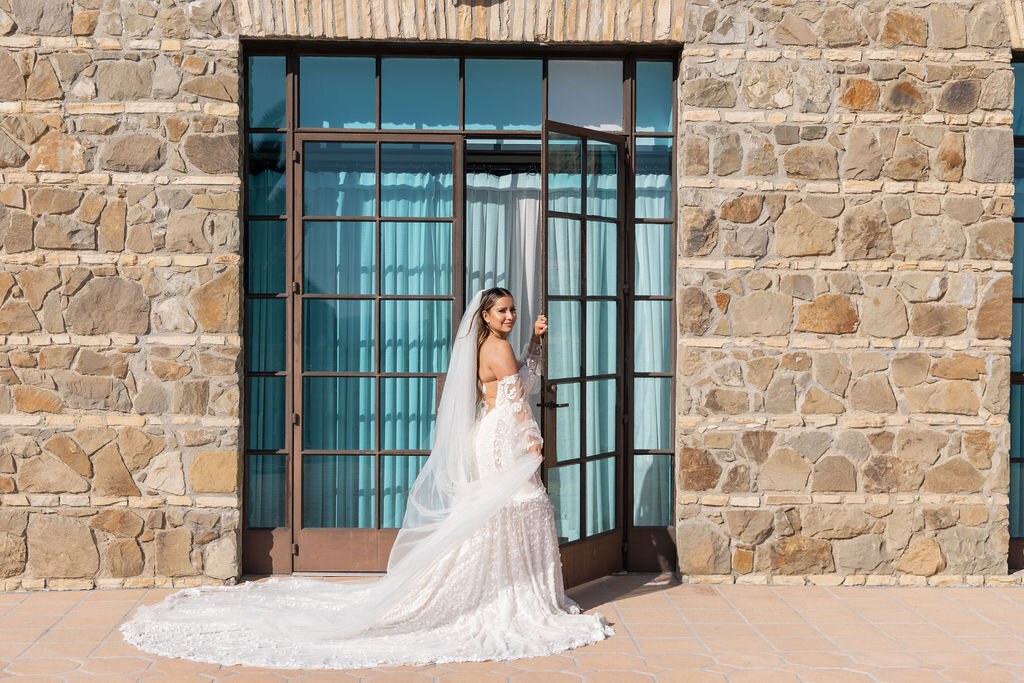 Bride wearing a long cathedral veil