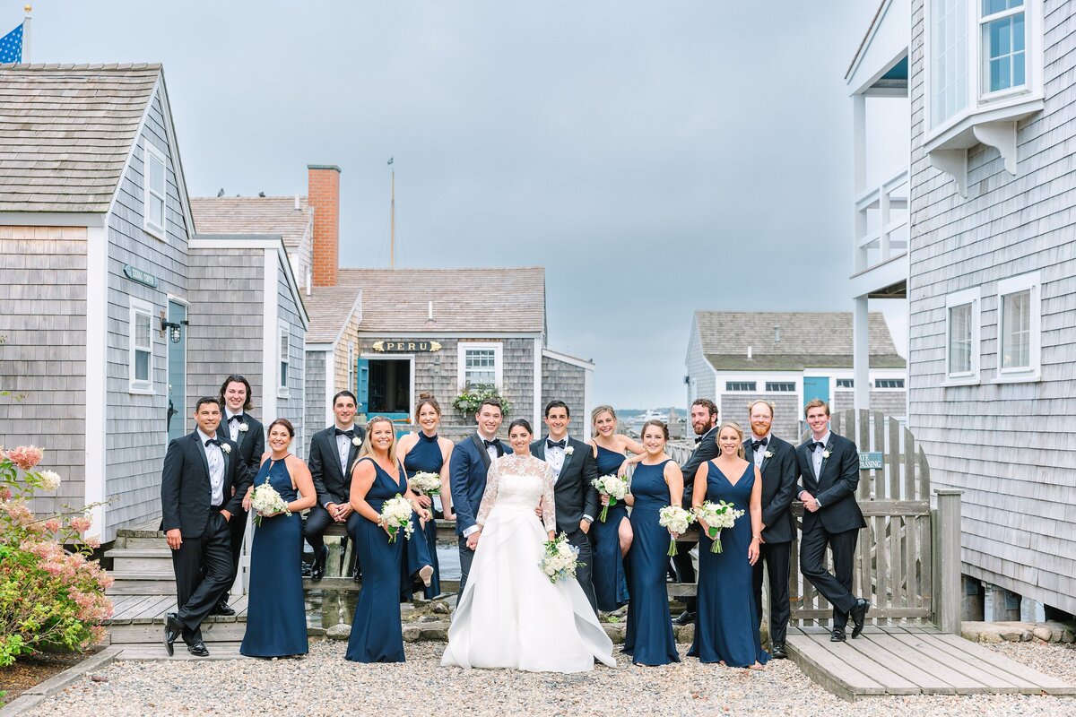 wedding party in vogue style pose at old north wharf in nantucket