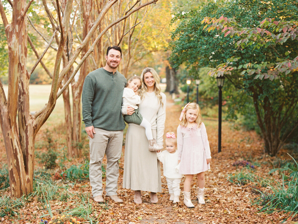 Family of 5 poses for a fall photo in Wake forest NC. Image by Raleigh maternity photographer A.J. Dunlap Photography.