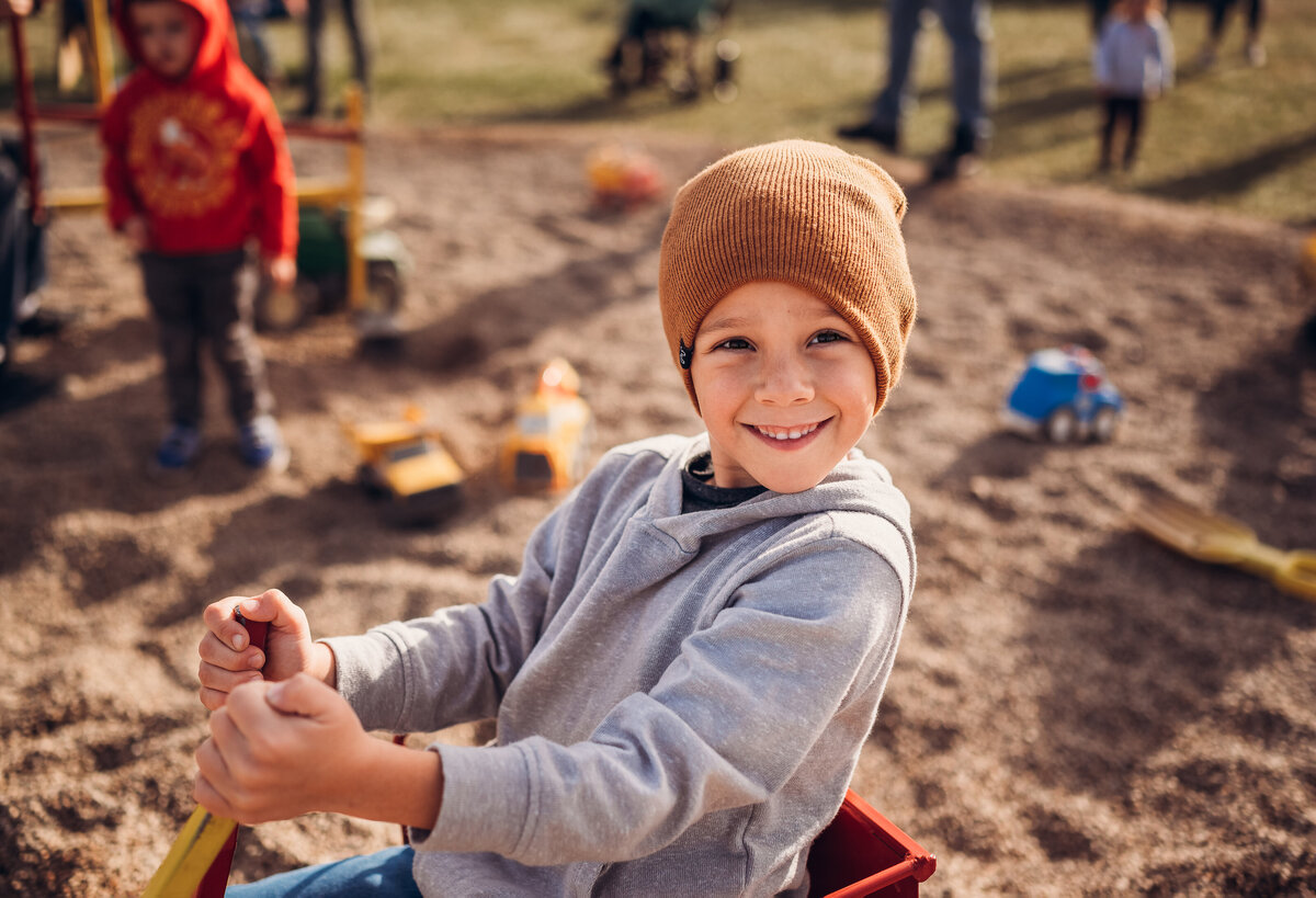 Boy playing at pumpkin patch