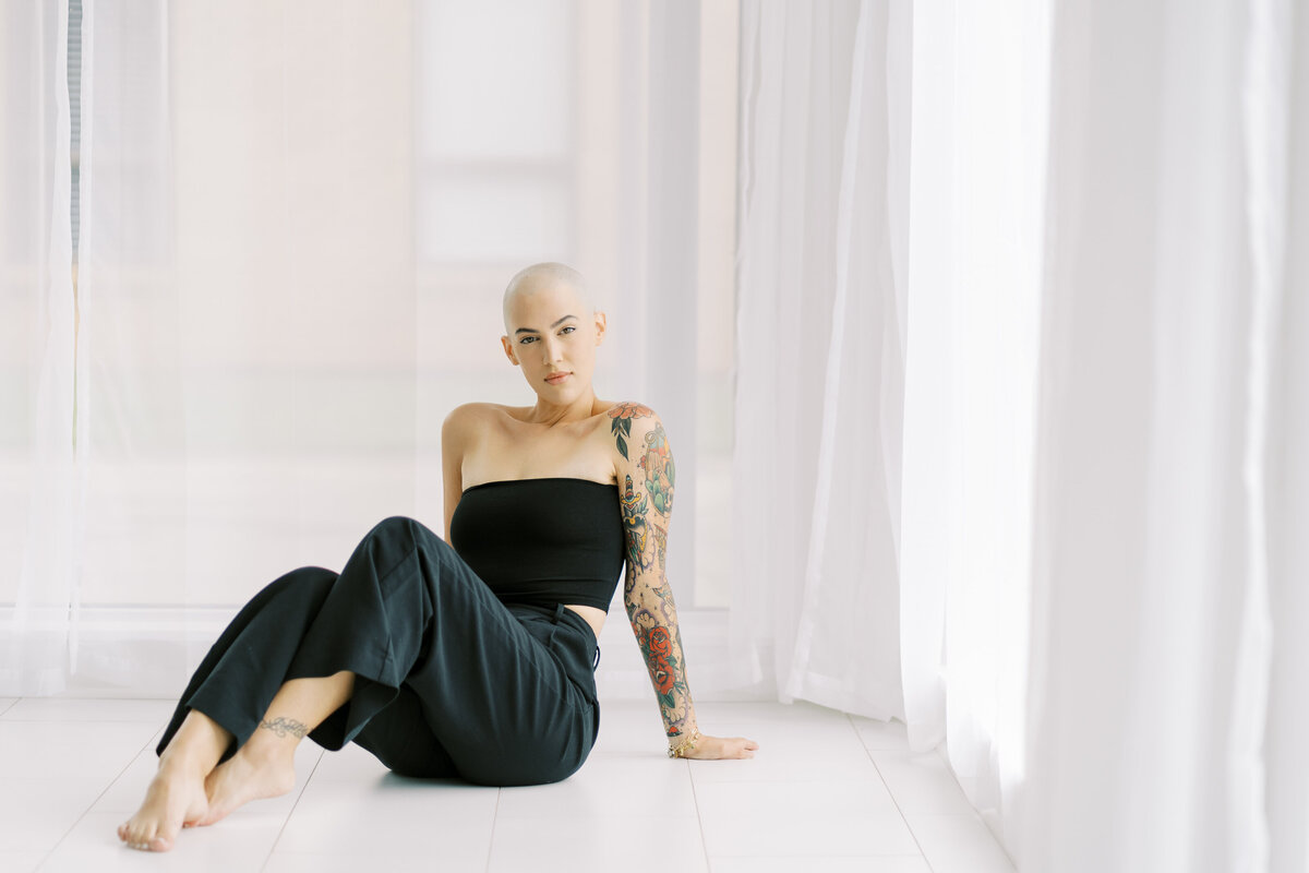 model posing in front of windows