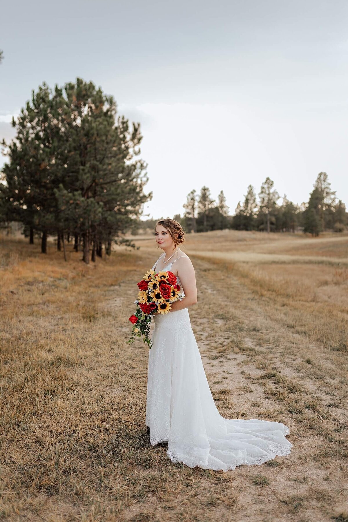 bridal portrait with her bouquet and pretty background