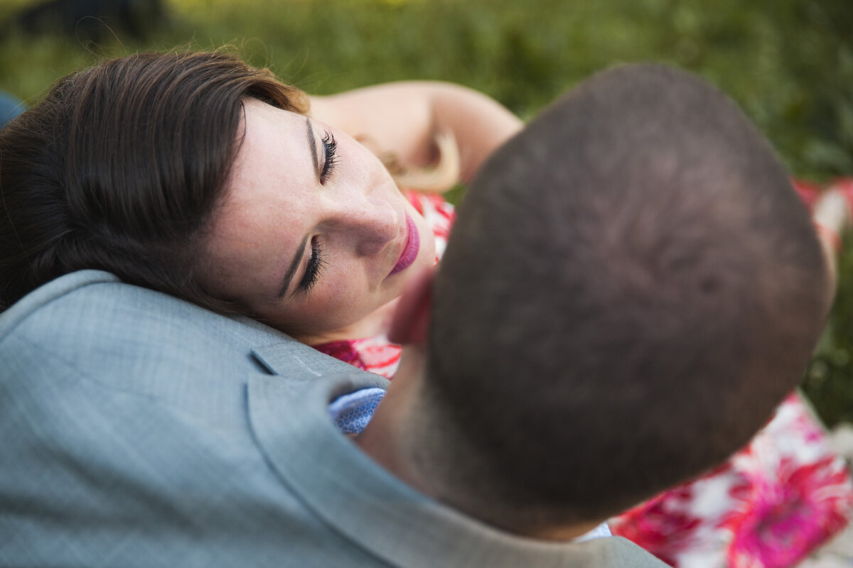 View from above of a couple leaning into one another at Meridian Hill.