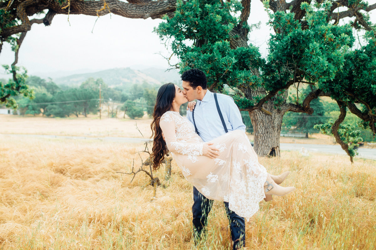 Engagement Photograph Of  Man Kissing While Carrying The Woman Los Angeles