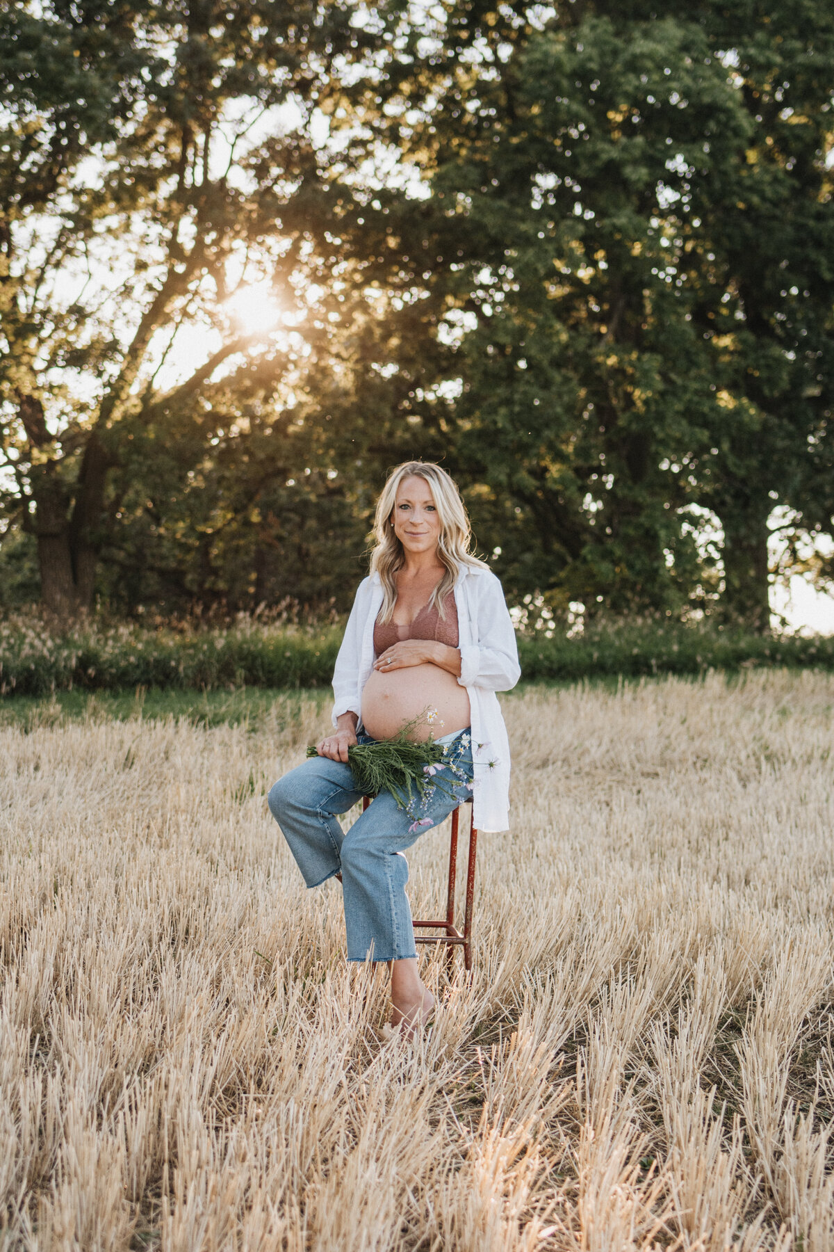 Summer sunset maternity session in Wisconsin farm field